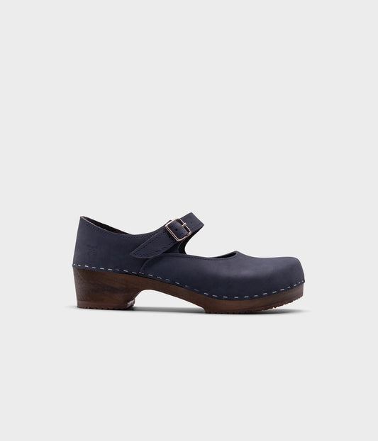Mary Jane wooden clogs in navy blue nubuck leather stapled on a dark wooden base