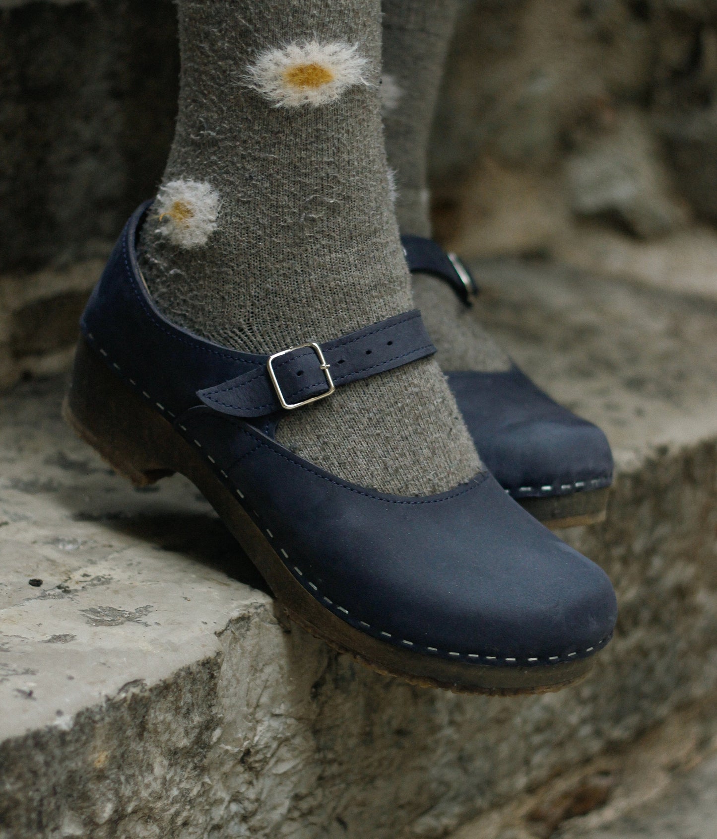 Mary Jane wooden clogs in navy blue nubuck leather stapled on a dark wooden base