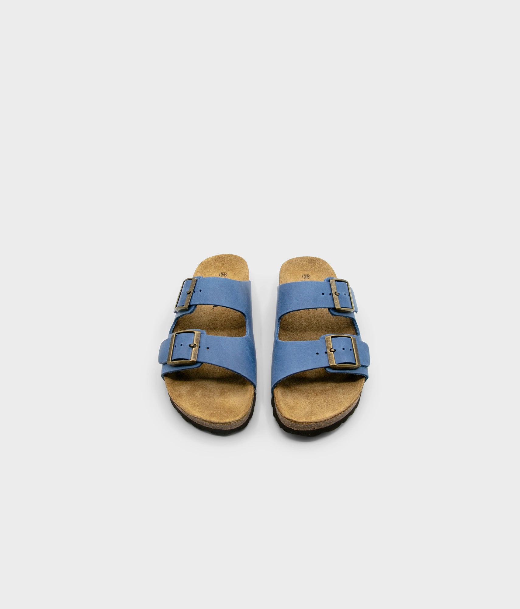 classic cork sandal with two straps in full-grain blue nubuck leather with a blue tint, suede footbed and brass gold studs