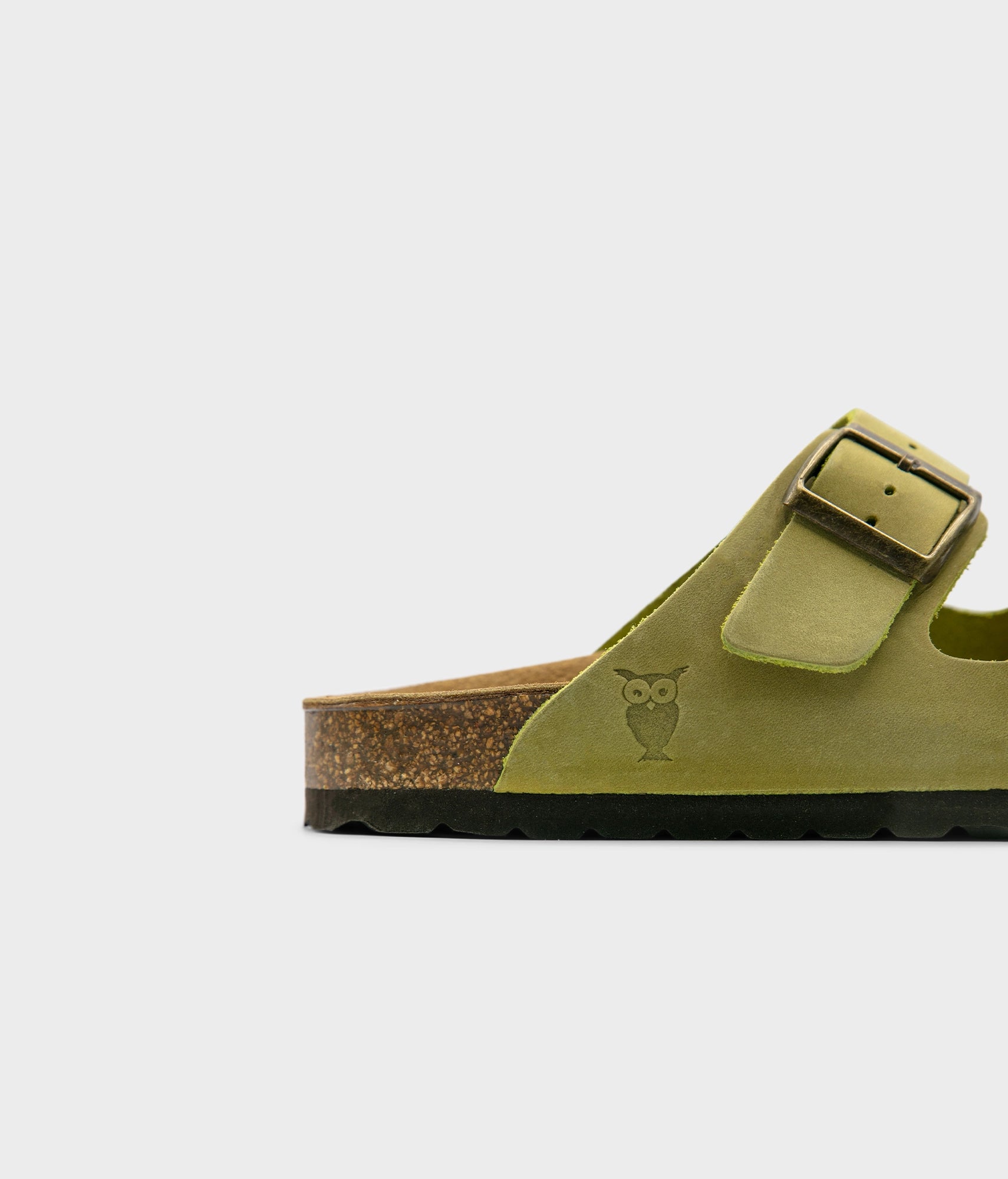 classic cork sandal with two straps in full-grain sage green nubuck leather with a blue tint, suede footbed and brass gold studs