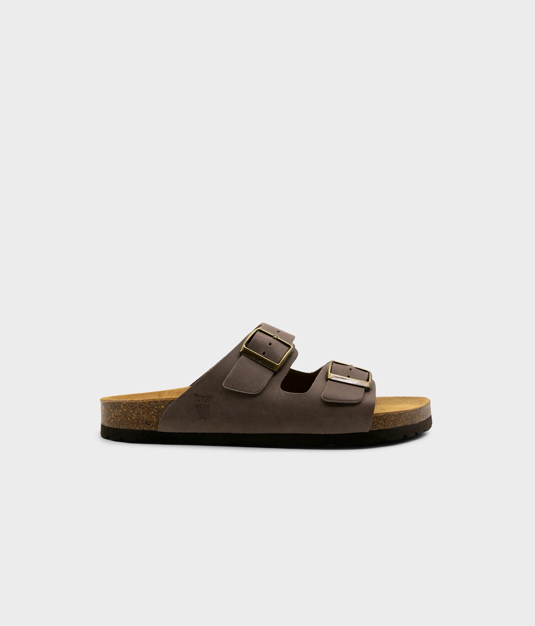 classic cork sandal with two straps in full-grain walnut brown nubuck leather with a blue tint, suede footbed and brass gold studs