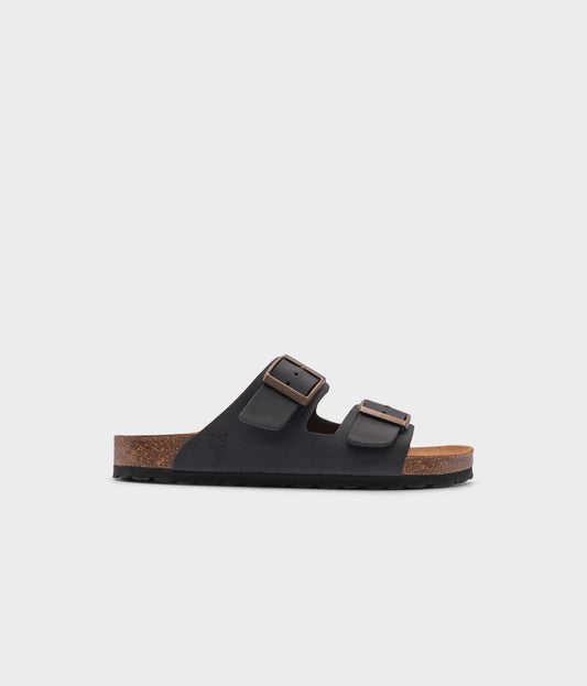 classic cork sandal with two straps in full-grain black nubuck leather with a blue tint, suede footbed and brass gold studs