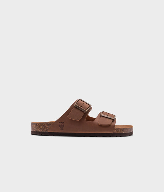 classic cork sandal with two straps in full-grain light brown nubuck leather, suede footbed and brass gold studs