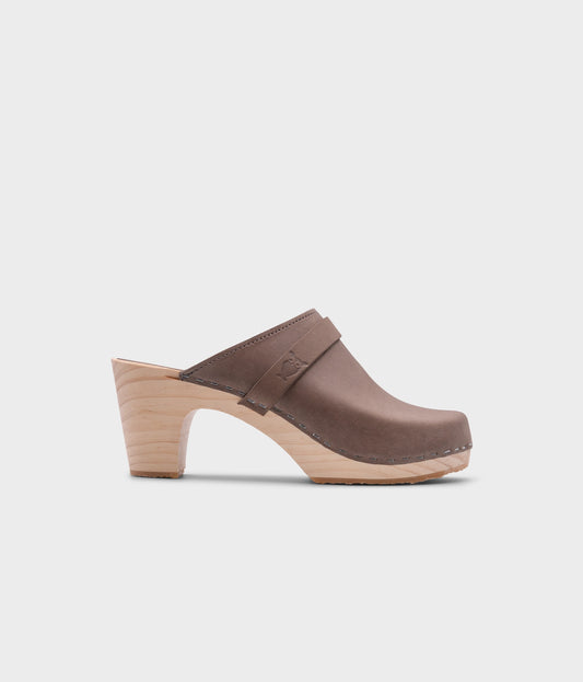 classic high rise heel clog mule in grey nubuck leather stapled on a light wooden base