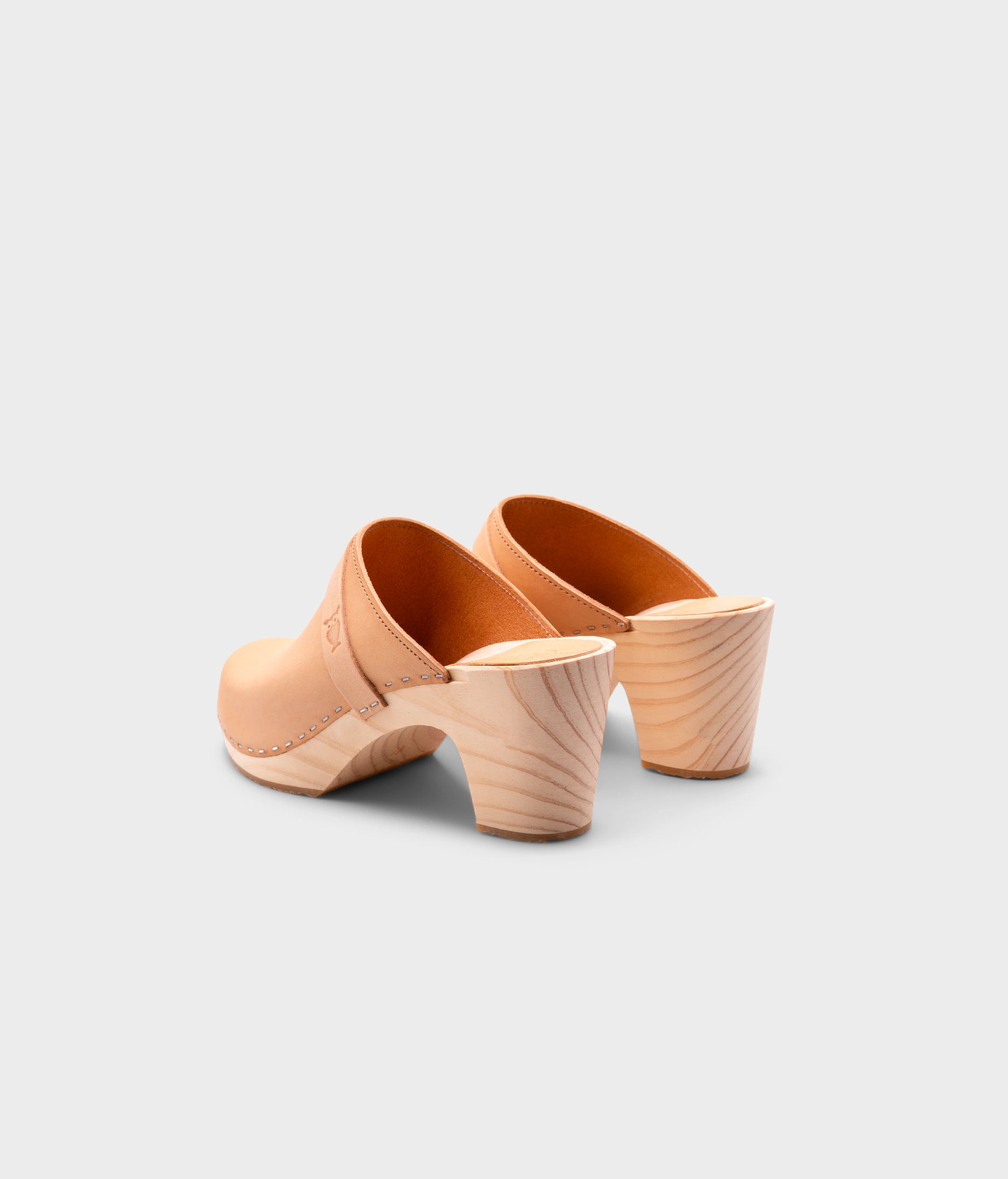 high rise classic clog mule in ecru beige vegetable tanned leather stapled on a light wooden base