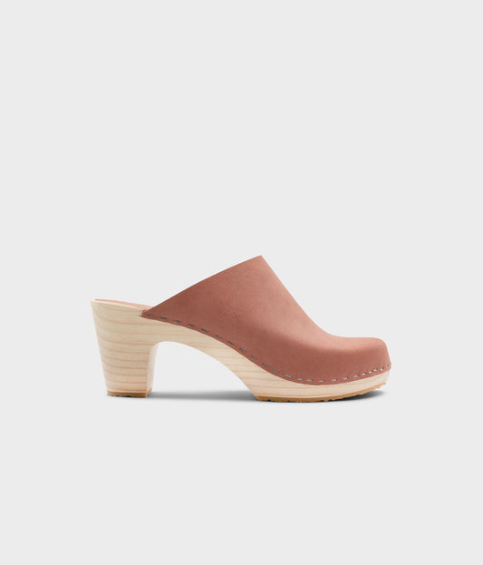 high rise minimalistic clog mule in blush pink nubuck leather stapled on a light wooden base