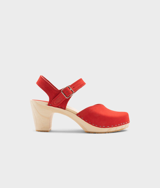 High rise heel classic clog sandals in red nubuck leather stapled on a light wooden base