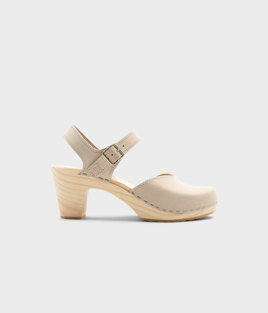 High rise heel classic clog sandals in sand white nubuck leather stapled on a light wooden base