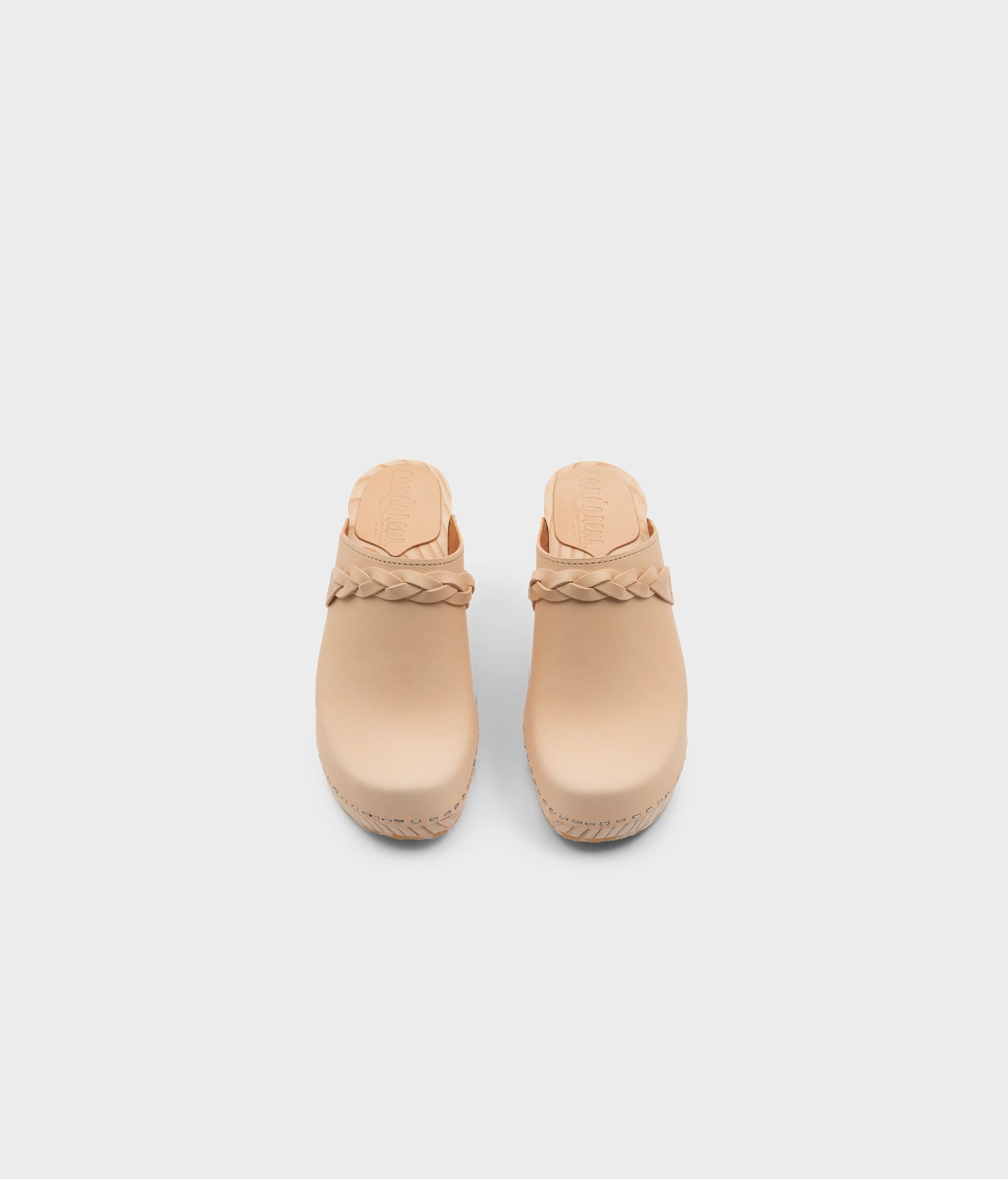 high rise heel braided clog mule in ecru beige vegetable tanned leather stapled on a light wooden base