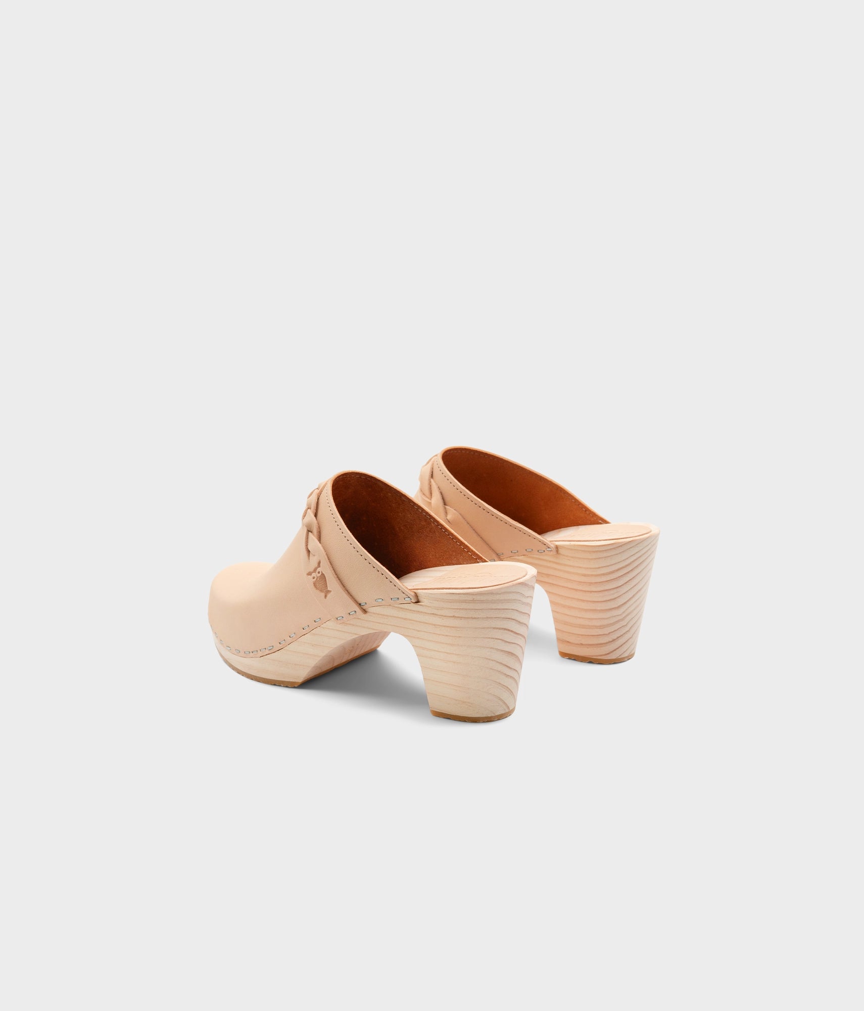 high rise heel braided clog mule in ecru beige vegetable tanned leather stapled on a light wooden base