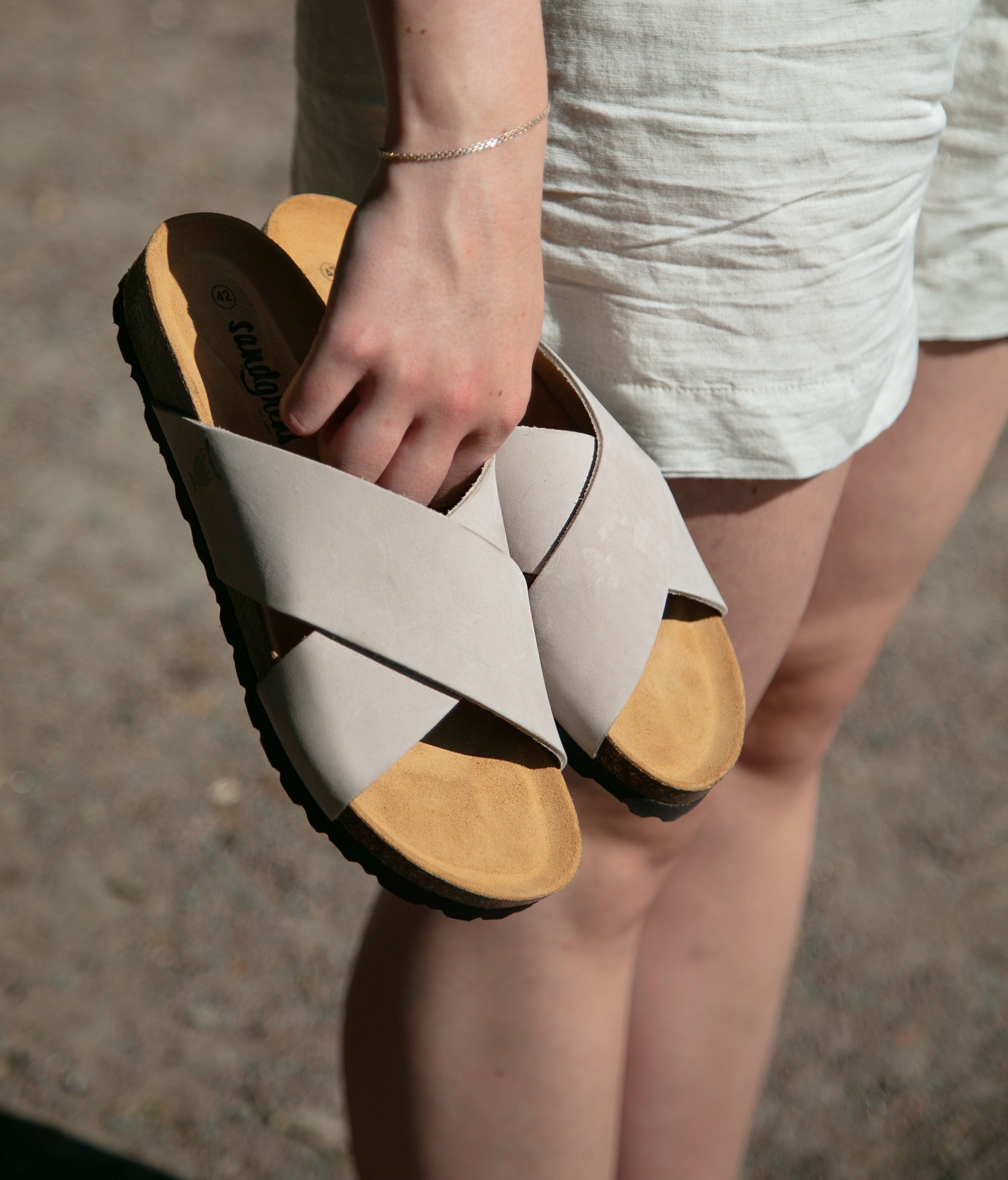 criss cross cork sandal in sandstone beige oiled full-grain nubuck leather with a brown EVA outersole and suede footbed