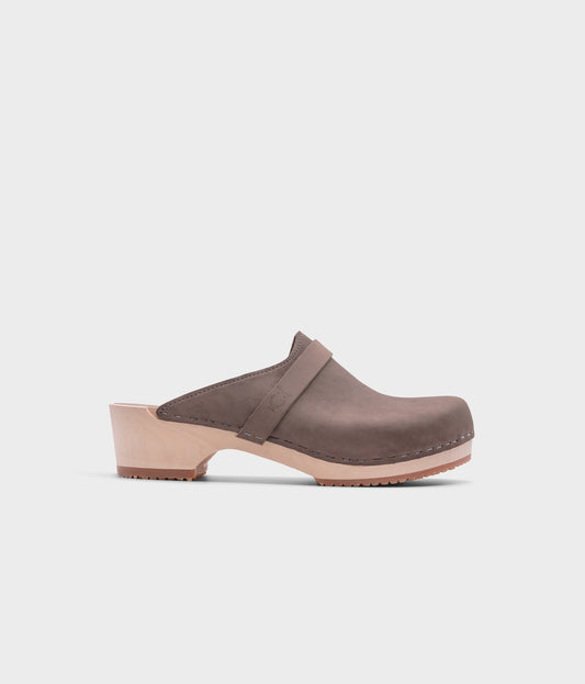 low heeled classic clog mules in stone grey nubuck leather stapled on a light wooden base