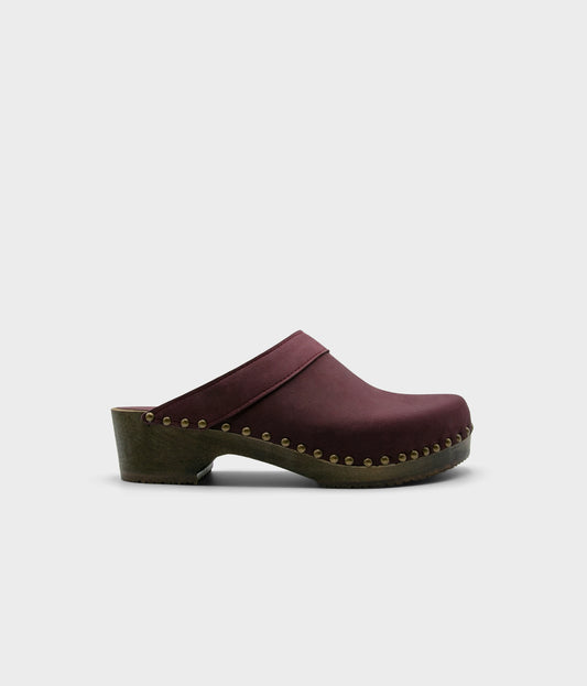 low heeled mens clog mule with brass gold studs, dark wooden base and purple plum nubuck leather