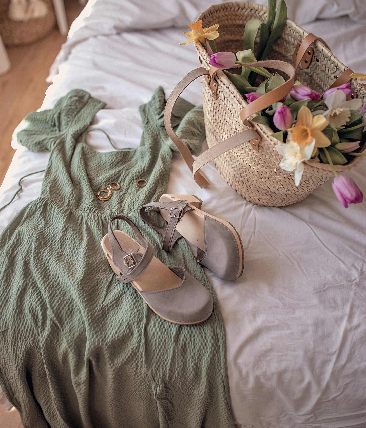 high heeled closed-toe clog sandal in stone grey nubuck leather stapled on a light wooden base