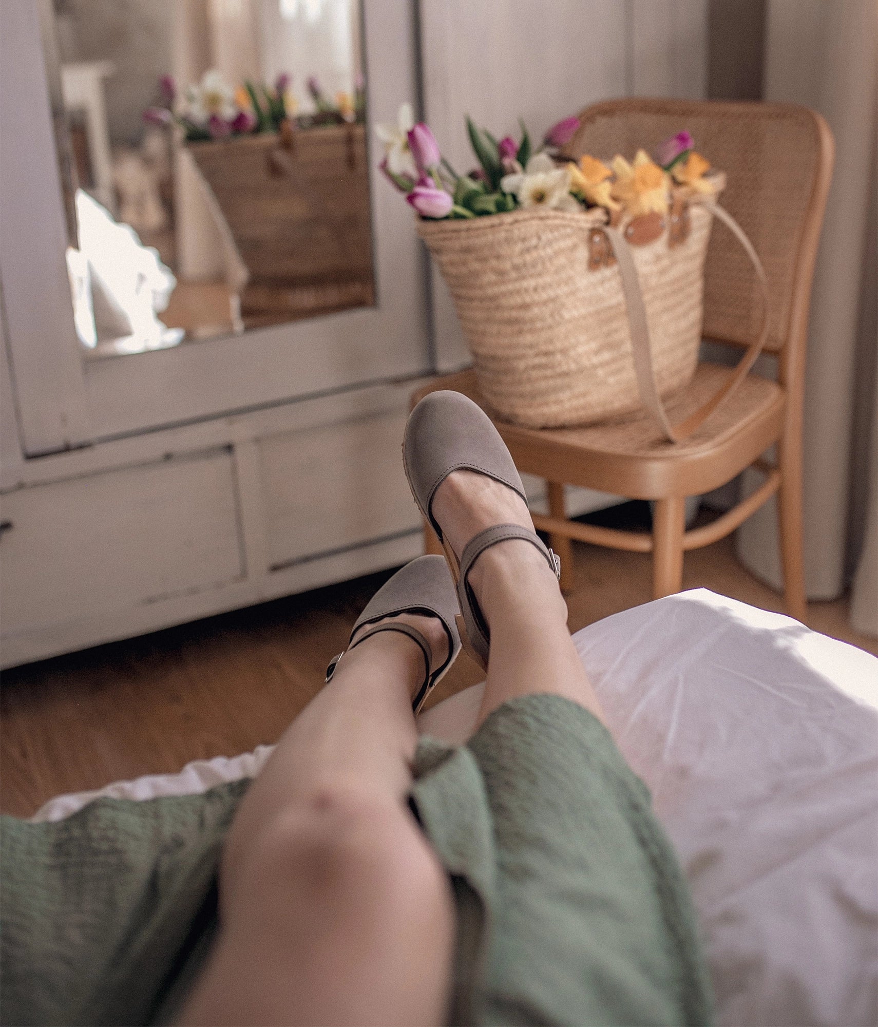 high heeled closed-toe clog sandal in stone grey nubuck leather stapled on a light wooden base