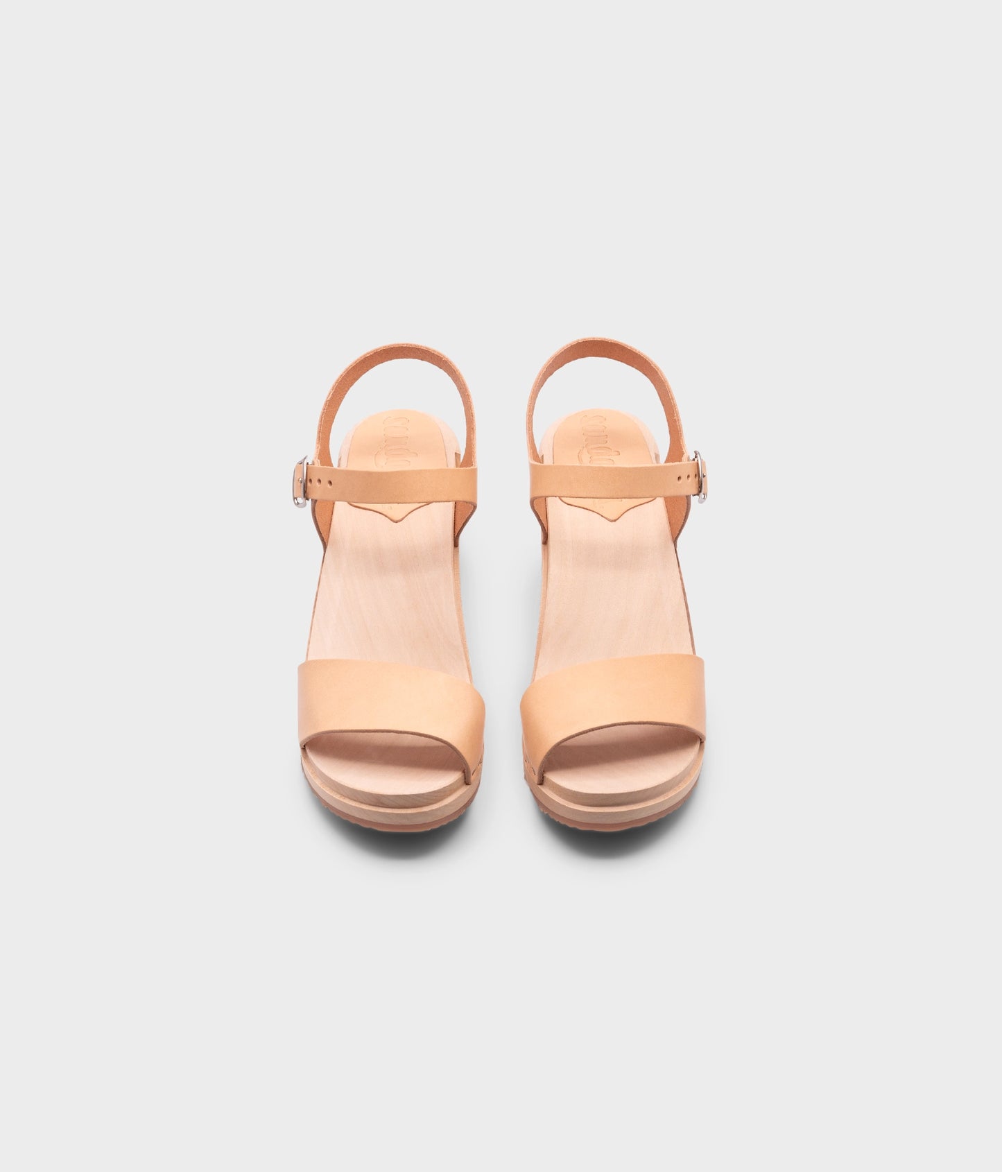 high-heeled open-toe clog sandal in ecru beige vegetable tanned leather stapled on a light wooden base