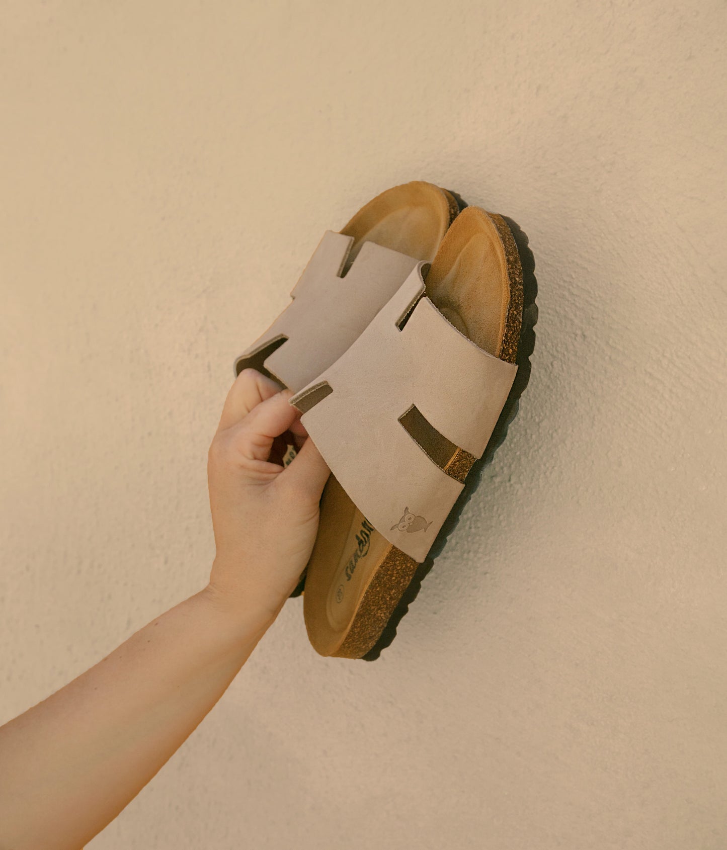 cork sandal with an H-shaped cutout in sandstone beige nubuck leather, suede footbed and black EVA outersole