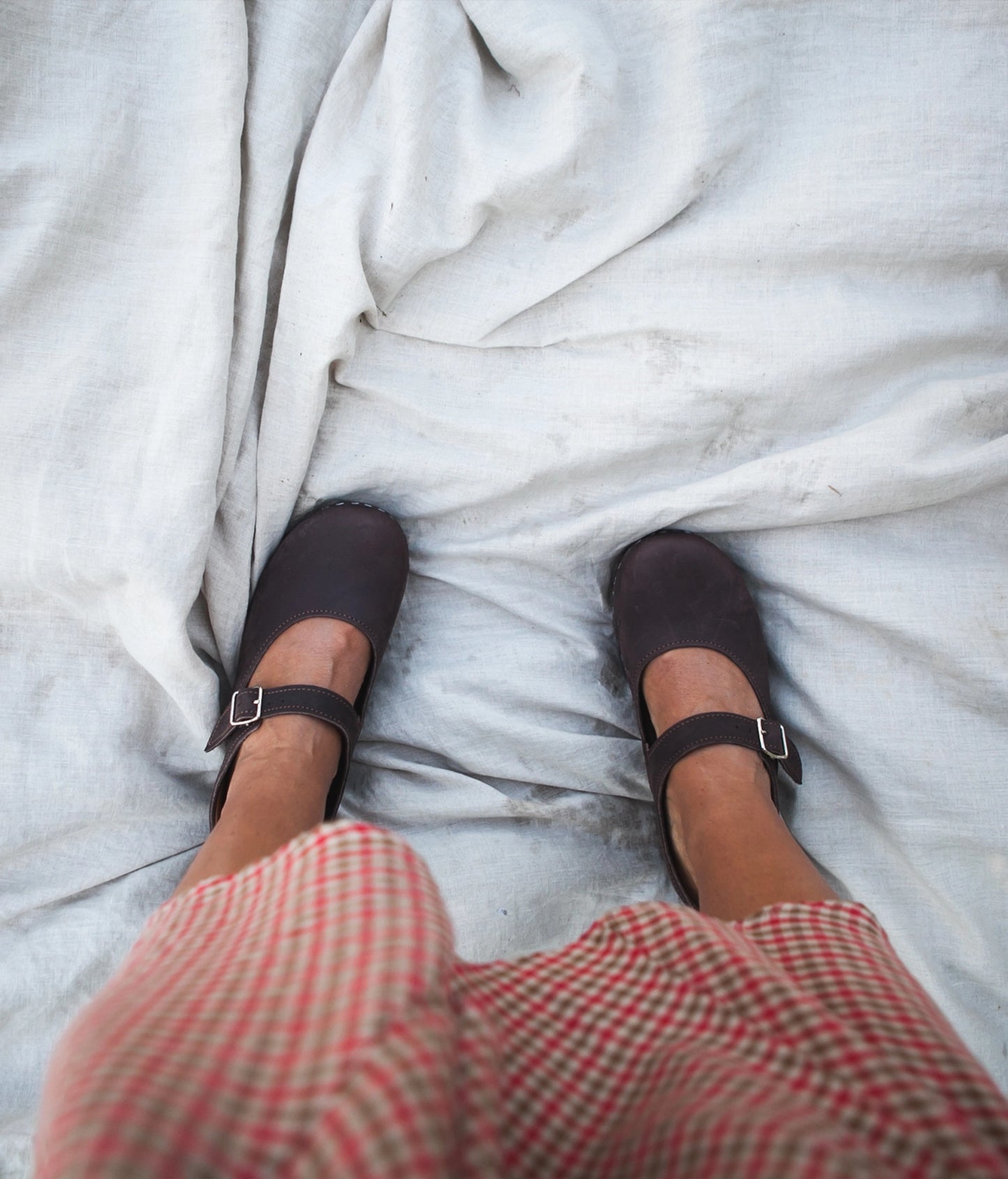 Mary Jane wooden clogs in dark brown nubuck leather stapled on a dark wooden base