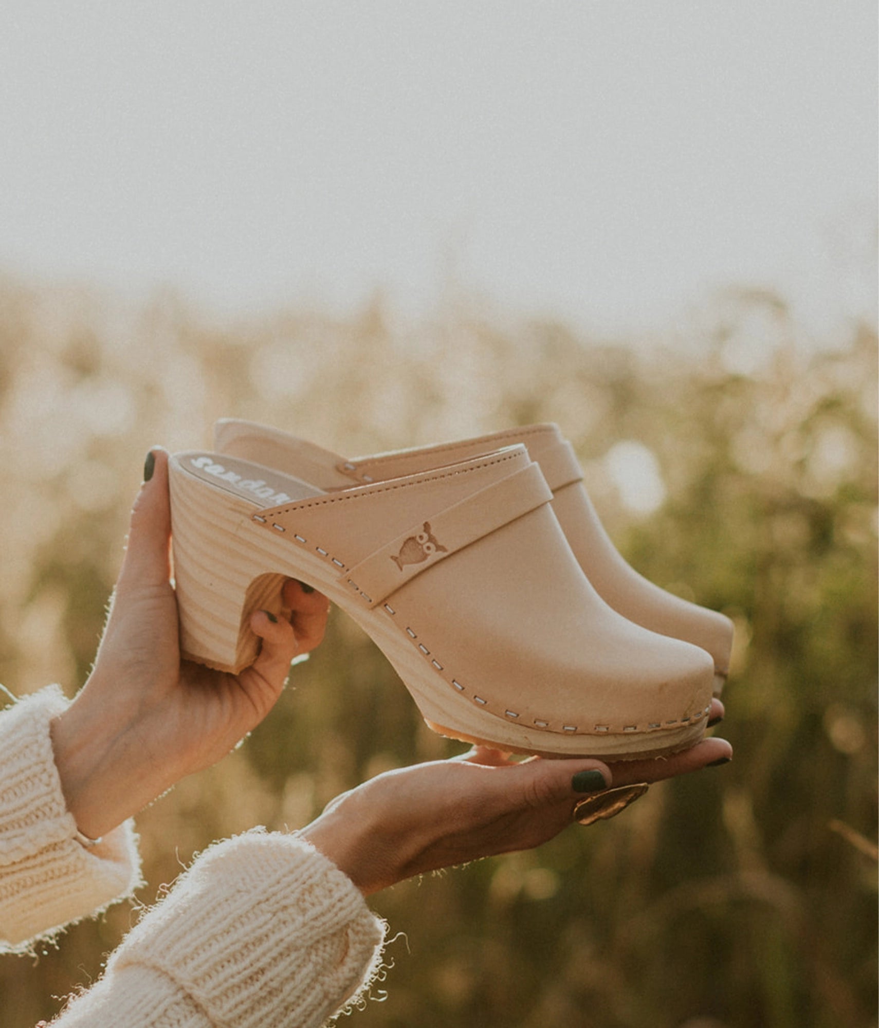 high rise classic clog mule in ecru beige vegetable tanned leather stapled on a light wooden base