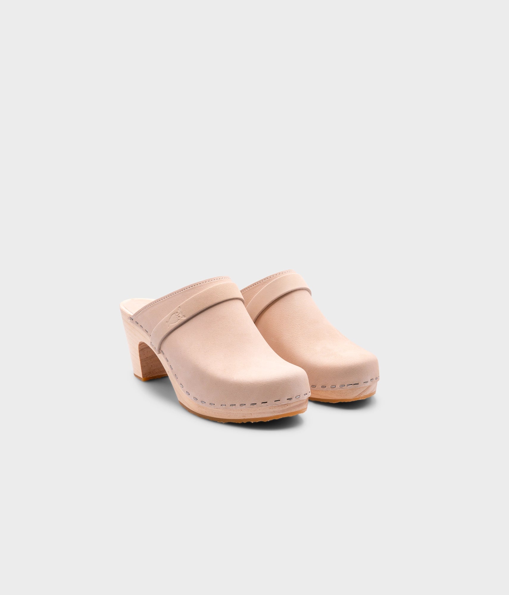 classic high rise heel clog mule in sand white nubuck leather stapled on a light wooden base