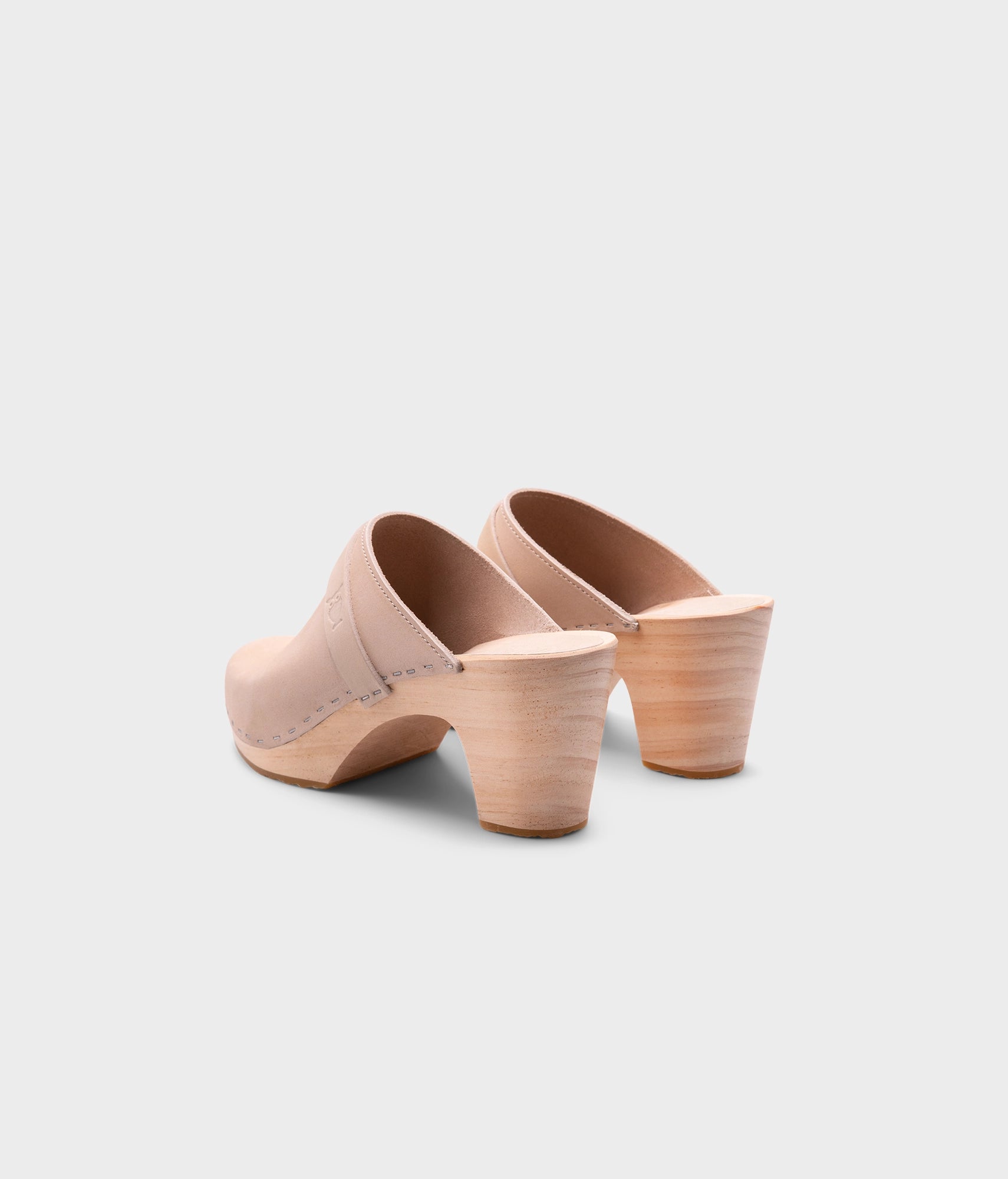 classic high rise heel clog mule in sand white nubuck leather stapled on a light wooden base