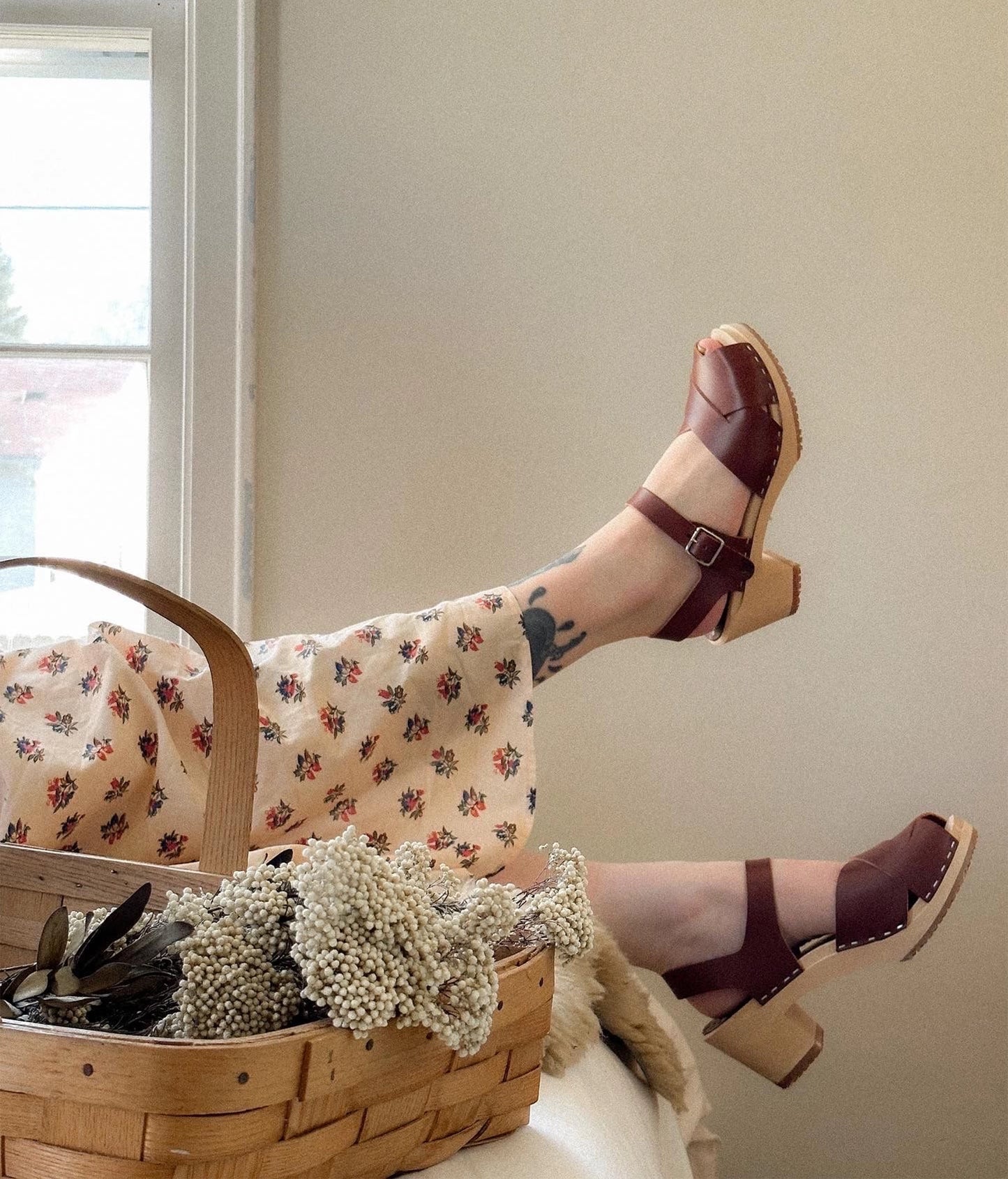 high heeled clog sandals in cognac red vegetable tanned leather with an open-toe stapled on a light wooden base