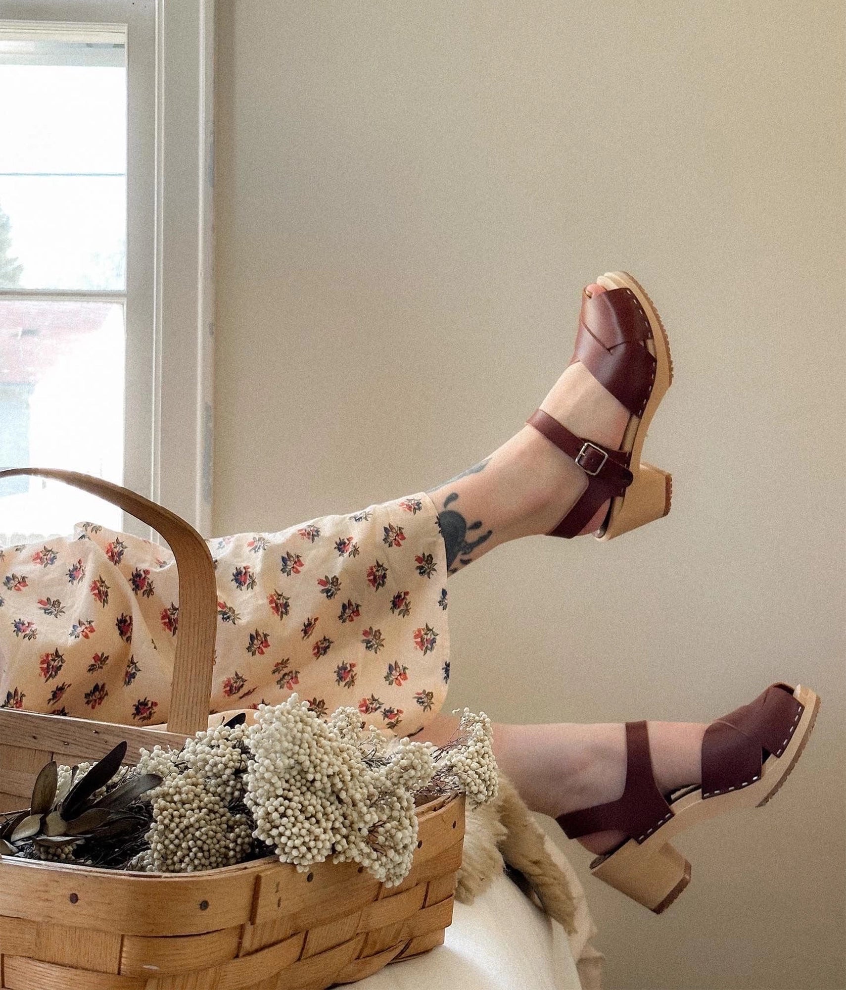 high heeled clog sandals in cognac red vegetable tanned leather with an open-toe stapled on a light wooden base