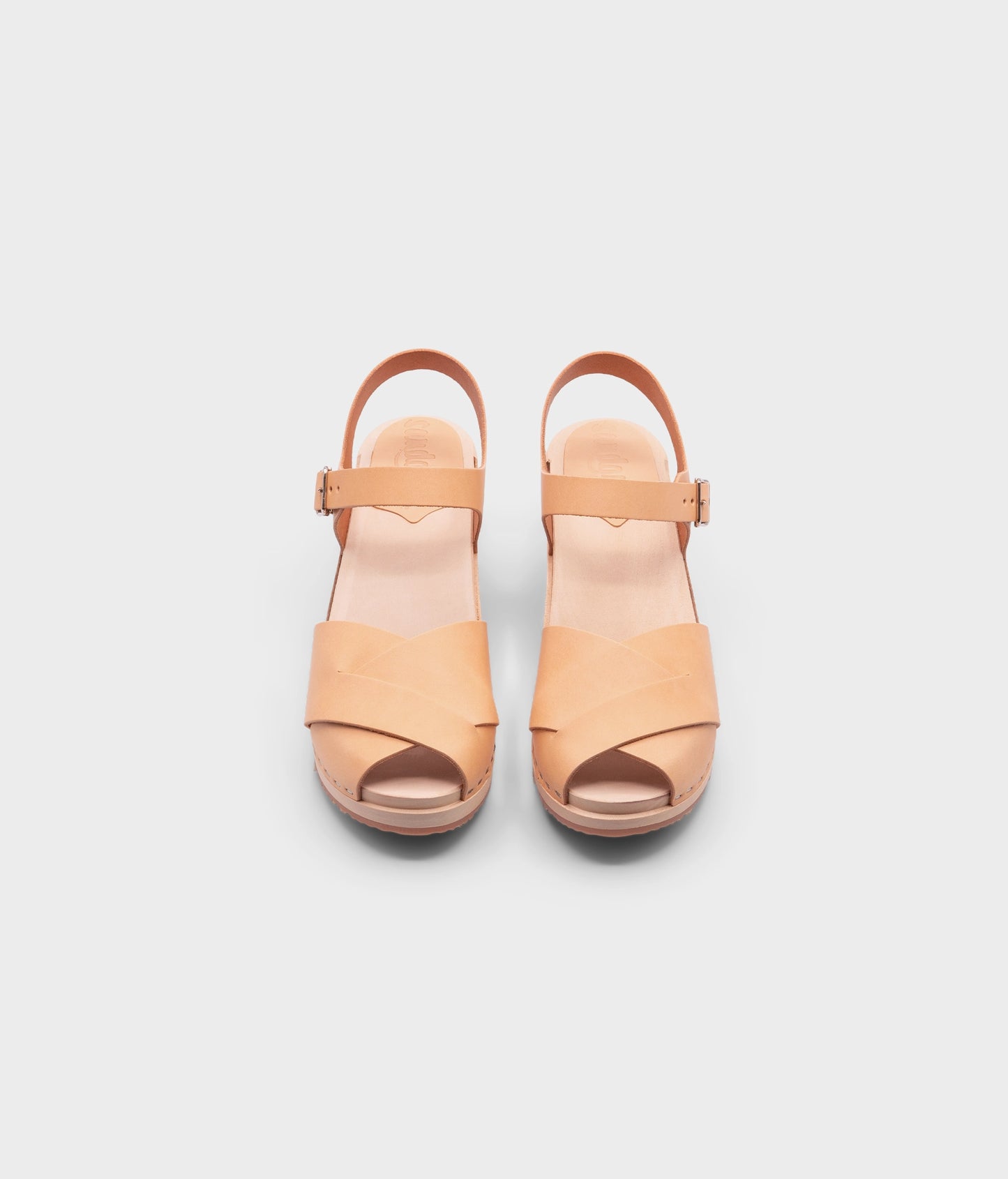 high heeled clog sandals in ecru beige vegetable tanned leather with an open-toe stapled on a light wooden base