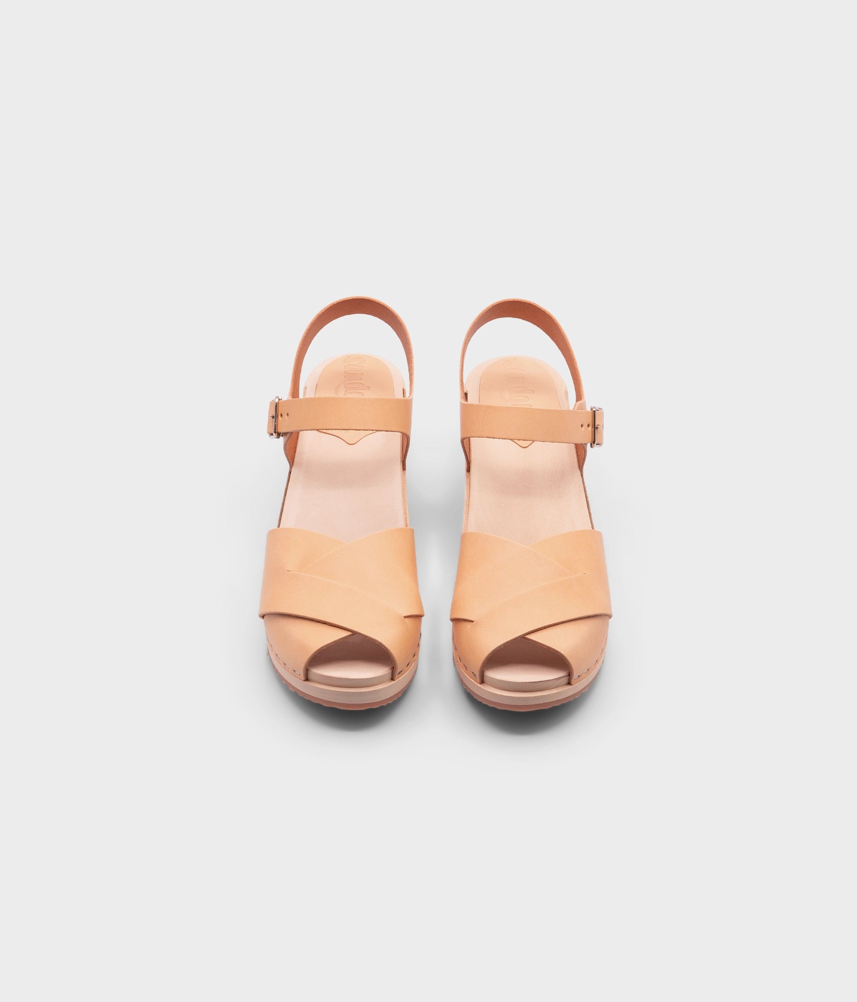 high heeled clog sandals in ecru beige vegetable tanned leather with an open-toe stapled on a light wooden base