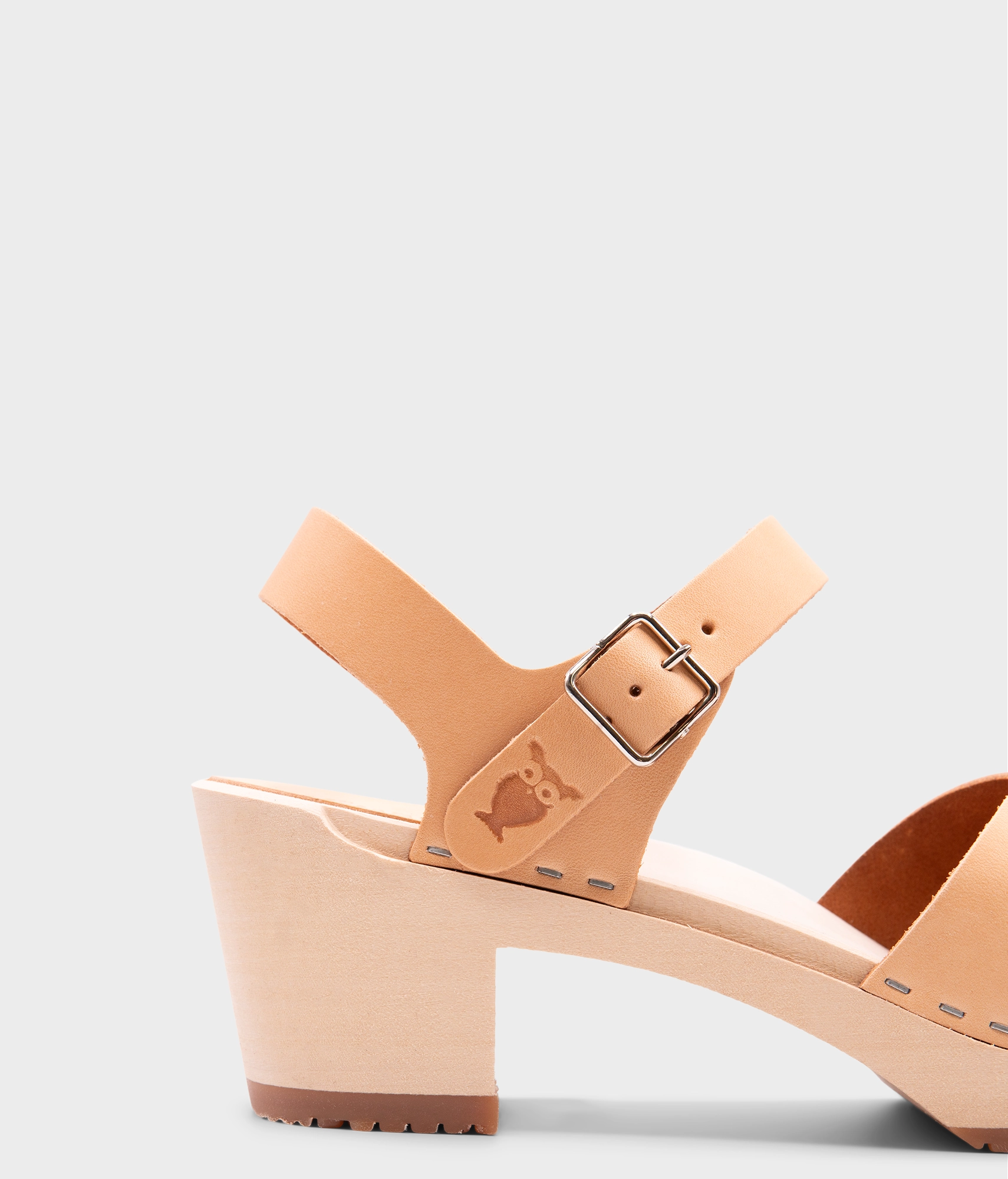 high heeled clog sandals in ecru beige vegetable tanned leather with an open-toe stapled on a light wooden base