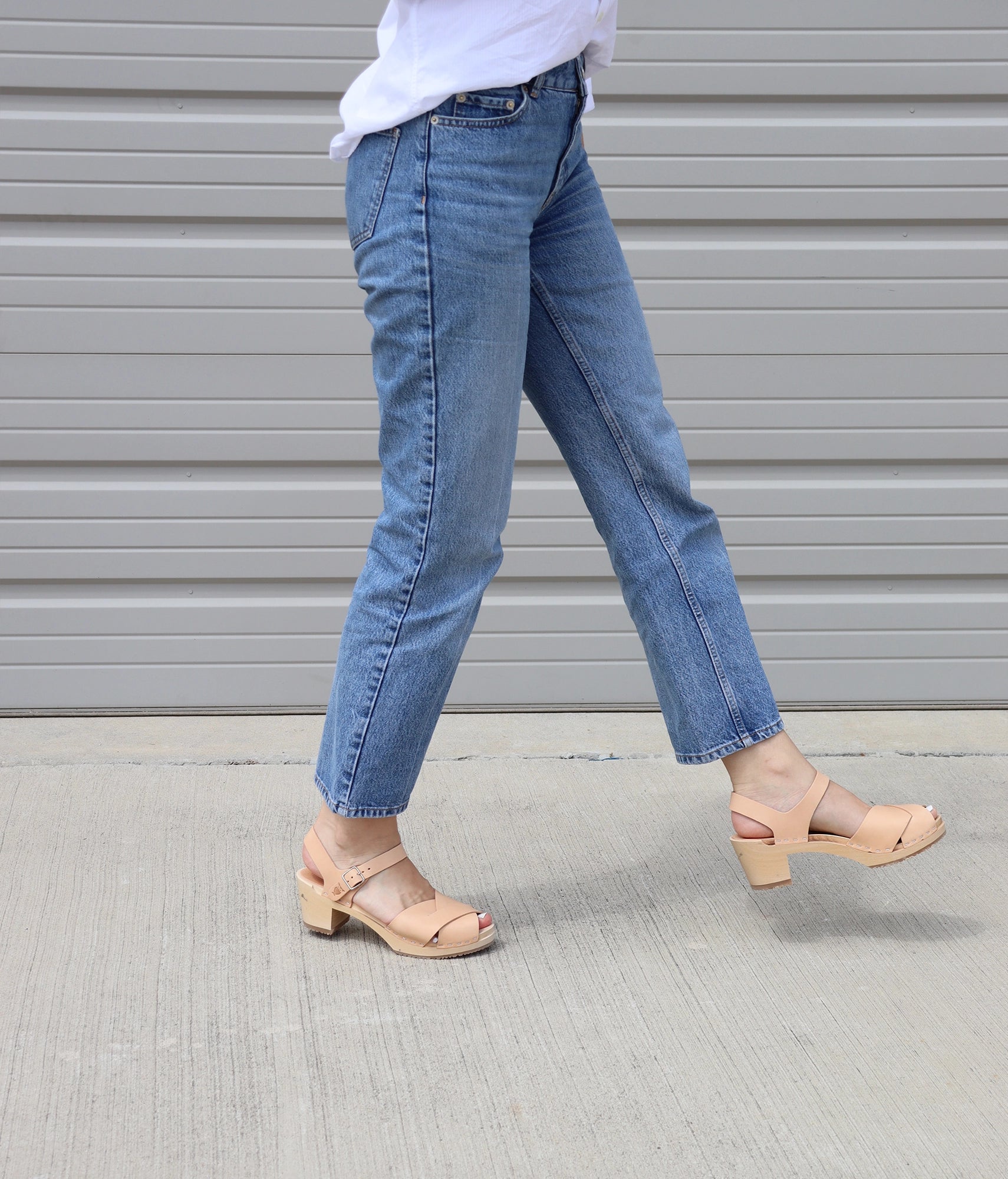 high heeled clog sandals in ecru beige vegetable tanned leather with an open-toe stapled on a light wooden base
