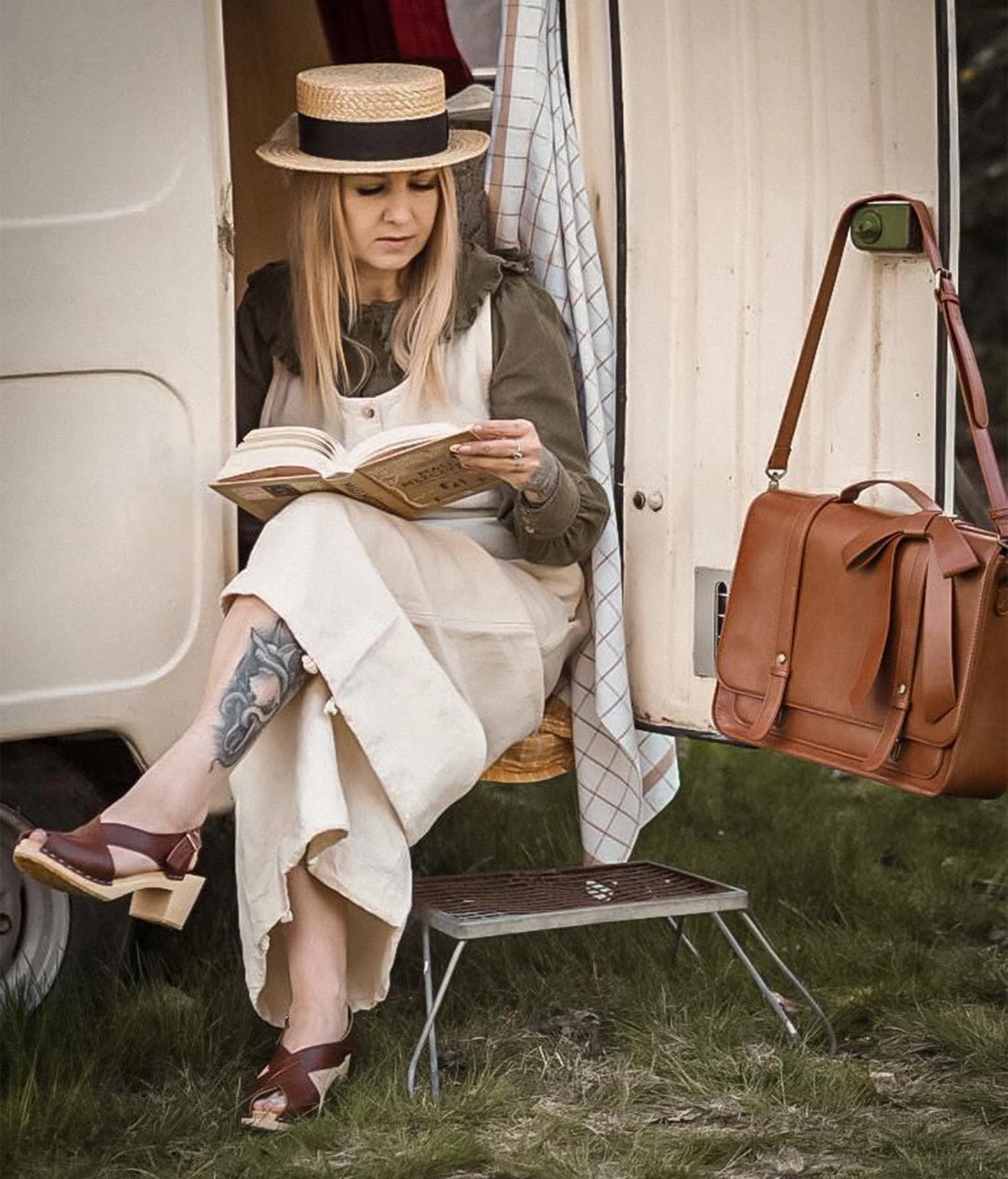 high heeled criss cross clog sandals in cognac red vegetable tanned leather stapled on a light wooden base