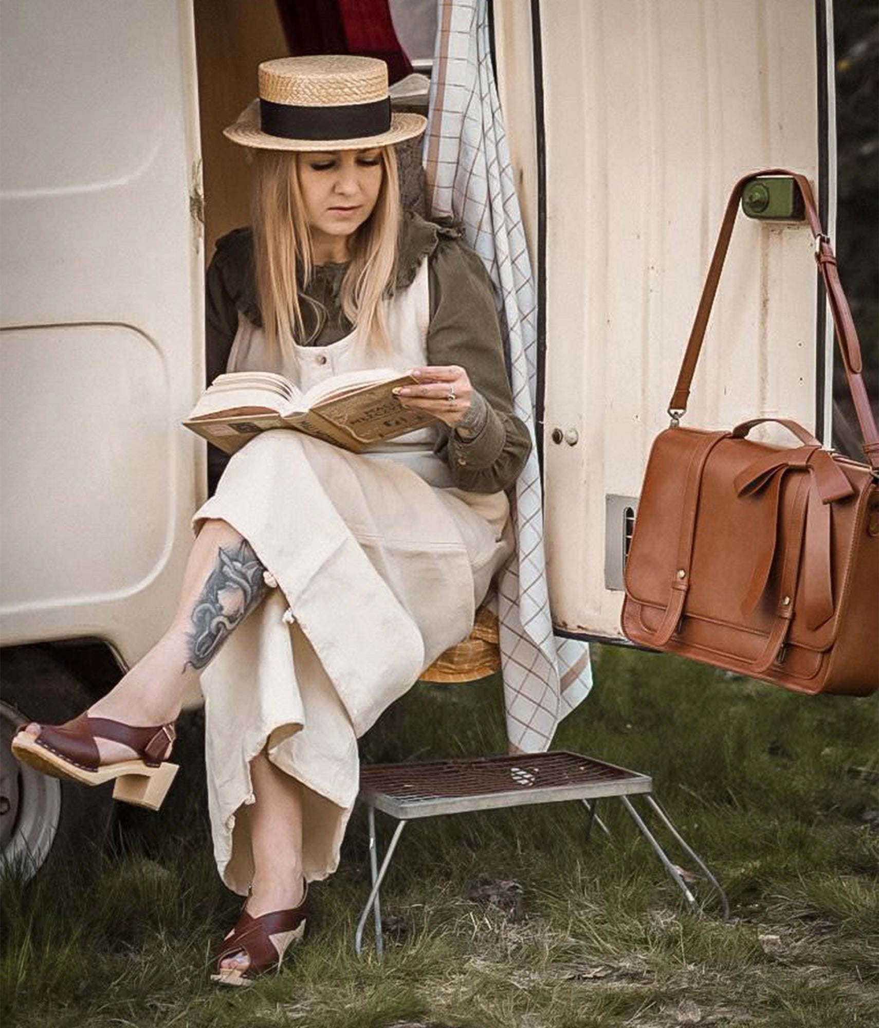 high heeled criss cross clog sandals in cognac red vegetable tanned leather stapled on a light wooden base
