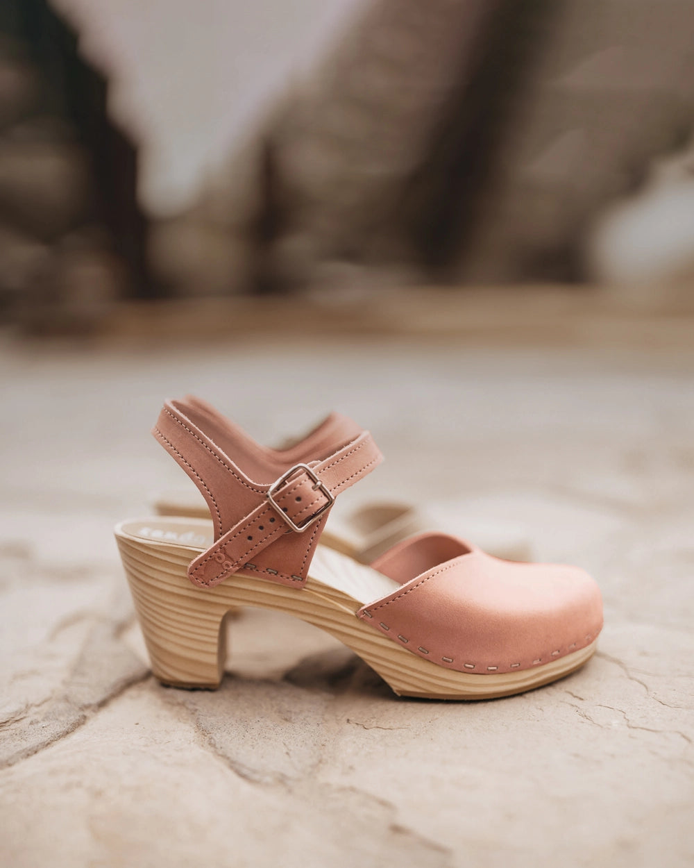 High rise heel classic clog sandals in blush pink nubuck leather stapled on a light wooden base