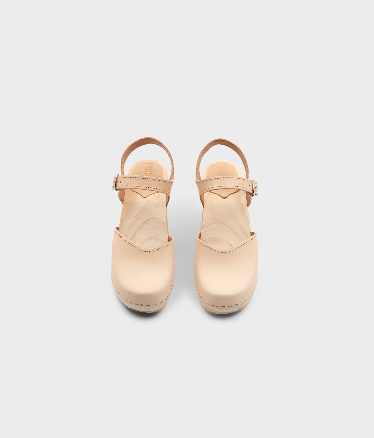 High rise heel classic clog sandals in ecru beige vegetable tanned leather stapled on a light wooden base