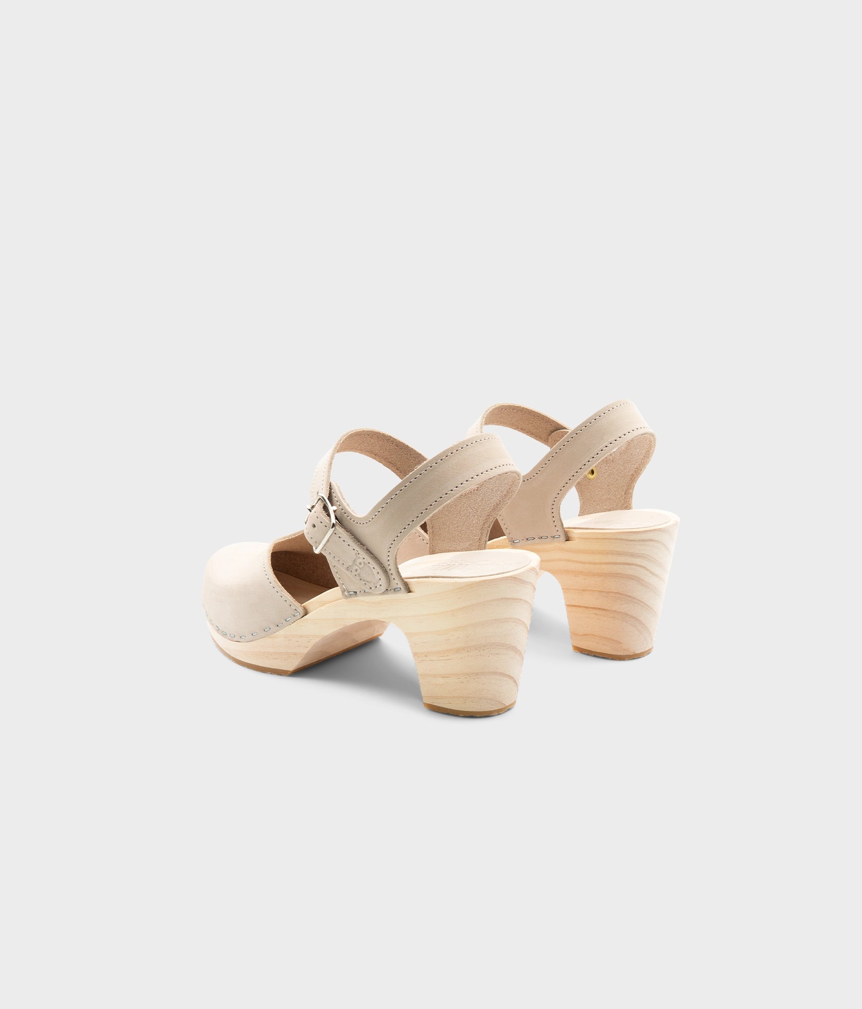 High rise heel classic clog sandals in sand white nubuck leather stapled on a light wooden base