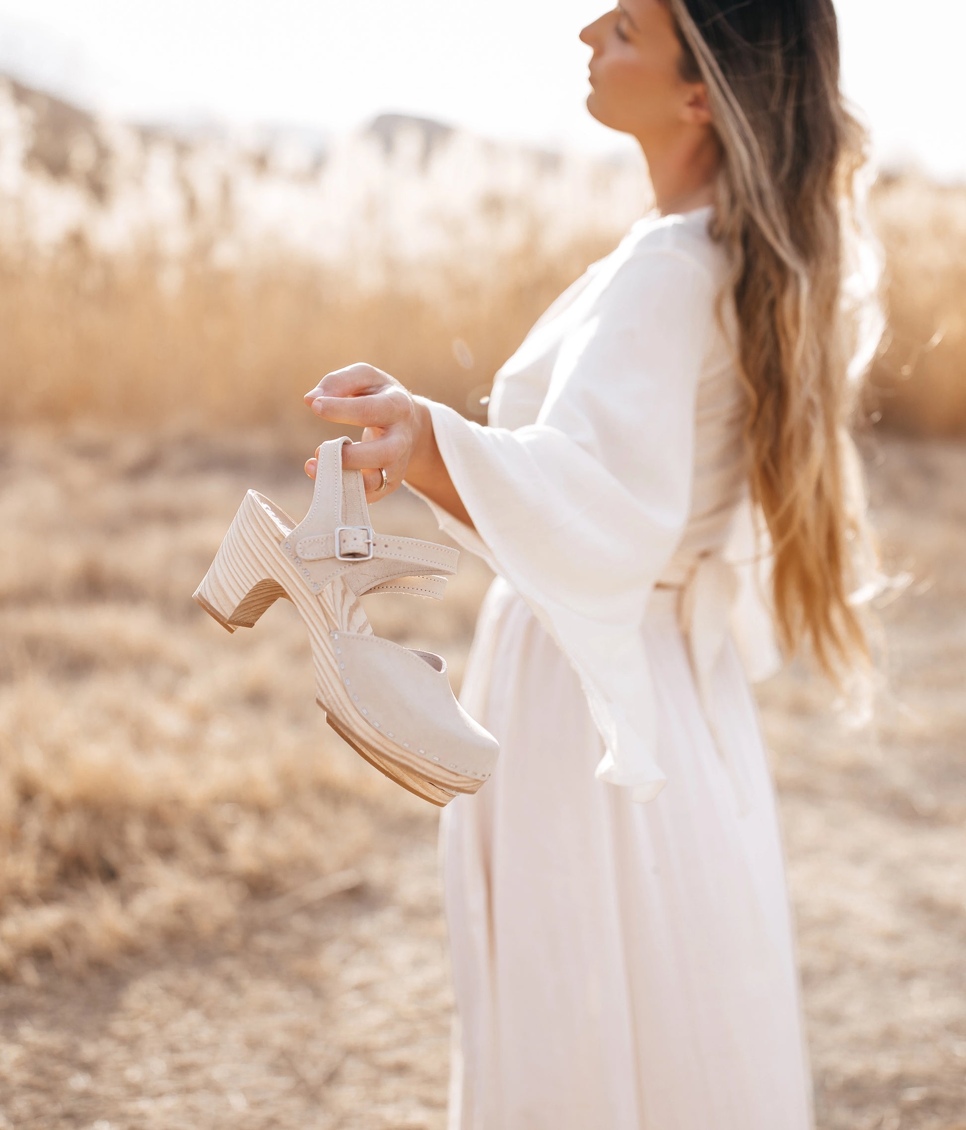 High rise heel classic clog sandals in sand white nubuck leather stapled on a light wooden base