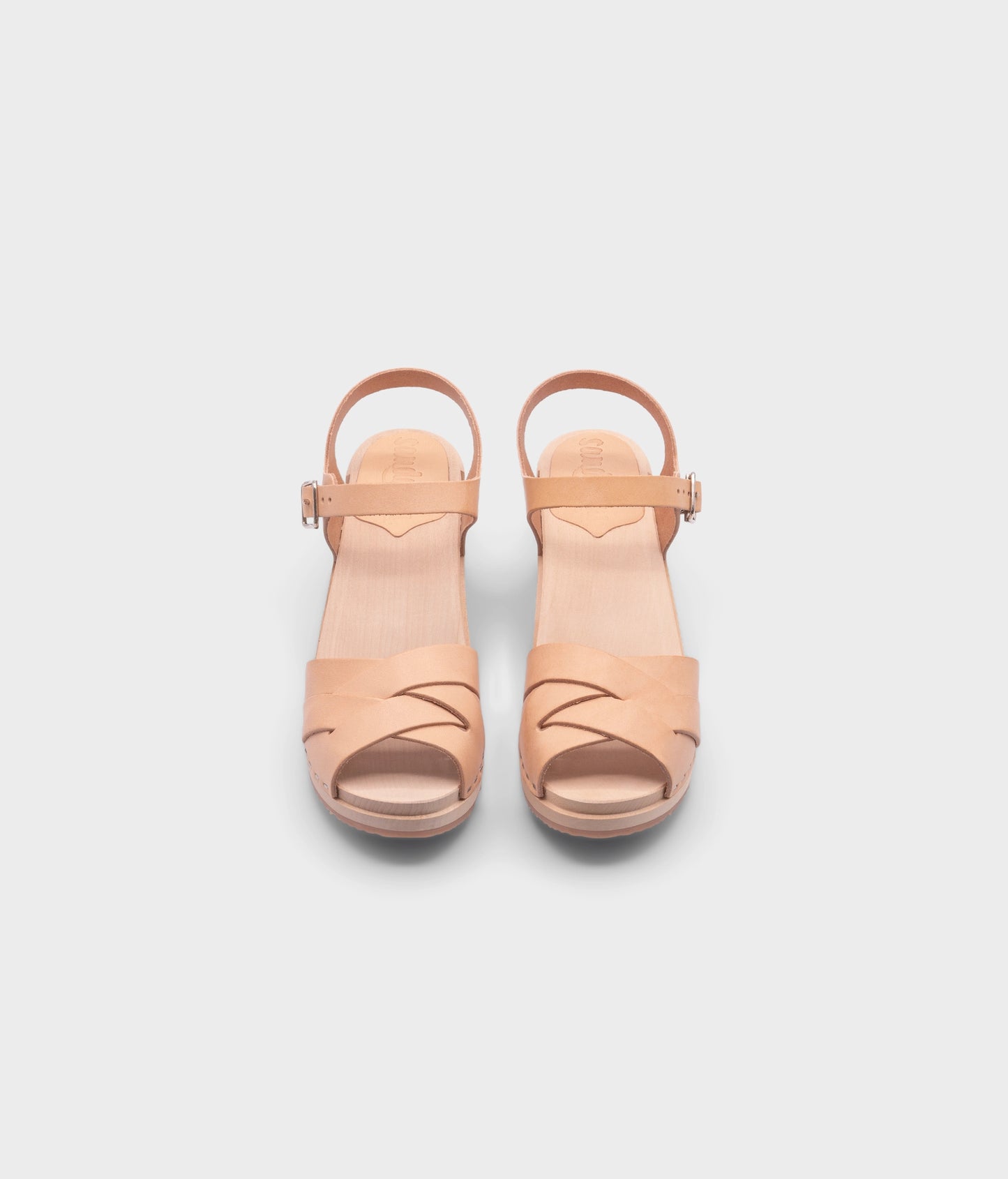 high heeled clog sandals in ecru beige vegetable tanned leather with an open-toe stapled on a light wooden base