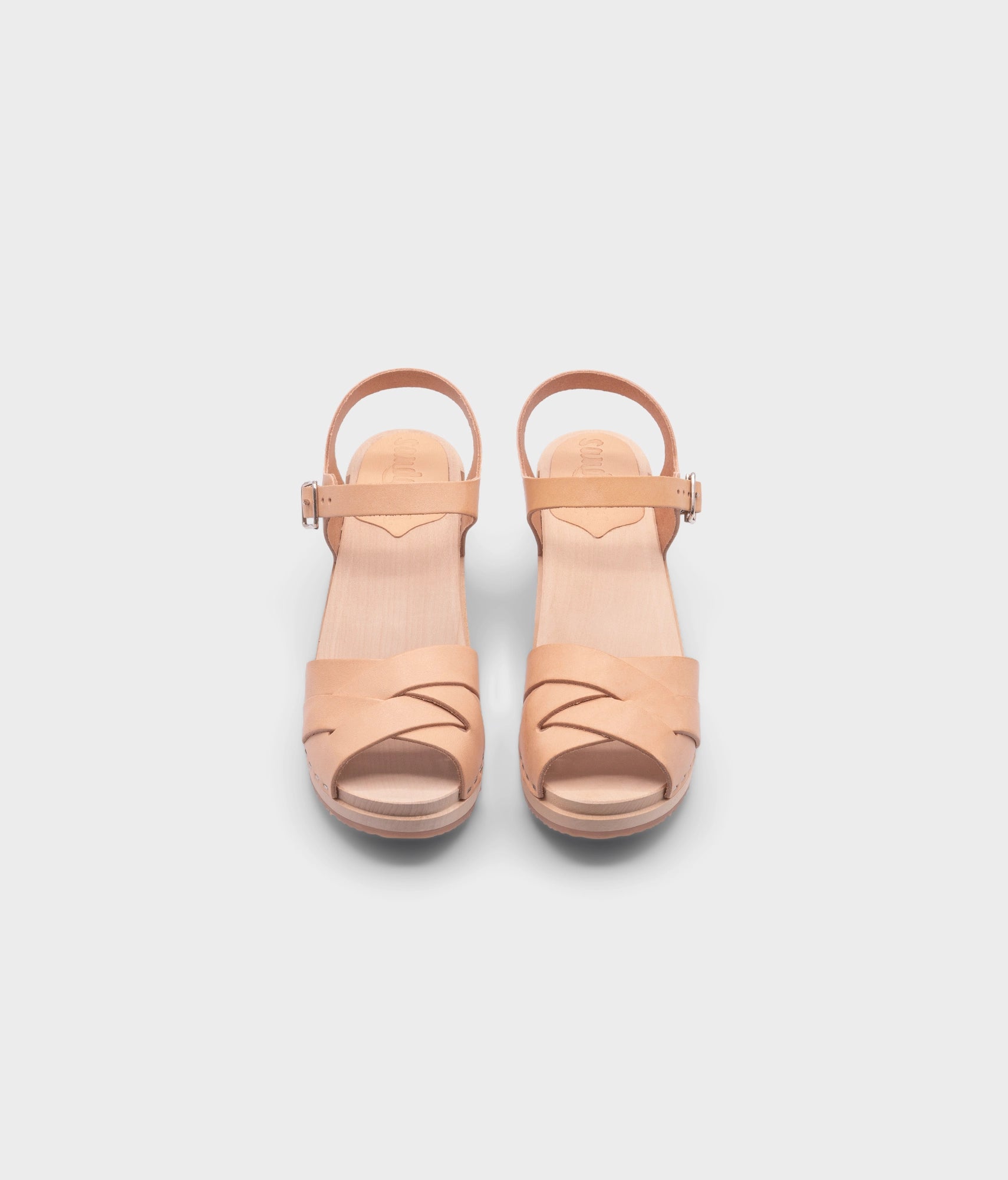 high heeled clog sandals in ecru beige vegetable tanned leather with an open-toe stapled on a light wooden base