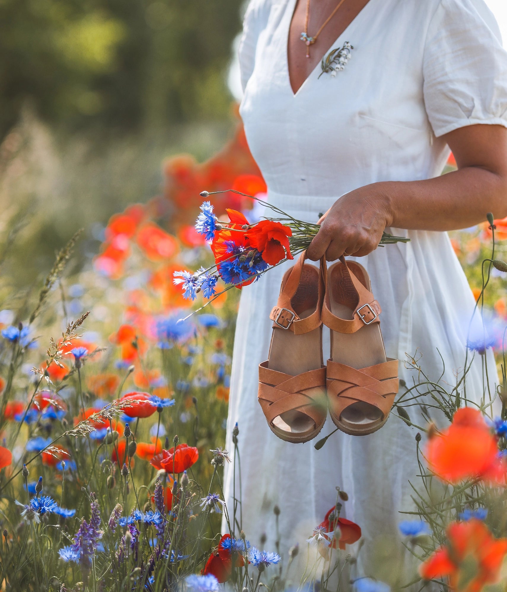 high heeled clog sandals in ecru beige vegetable tanned leather with an open-toe stapled on a light wooden base
