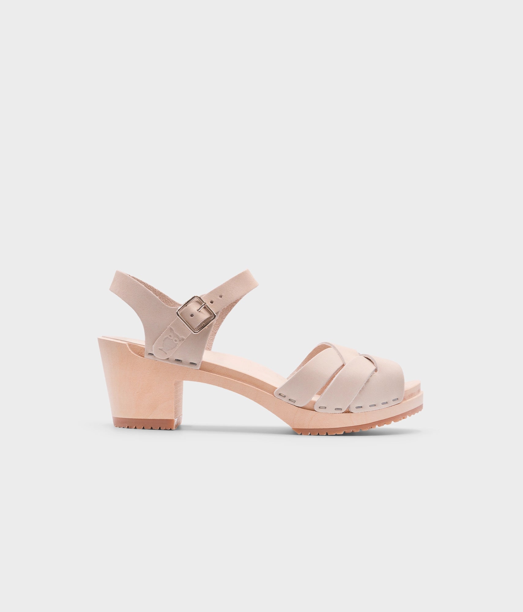 high heeled clog sandals in sand white nubuck leather with an open-toe stapled on a light wooden base