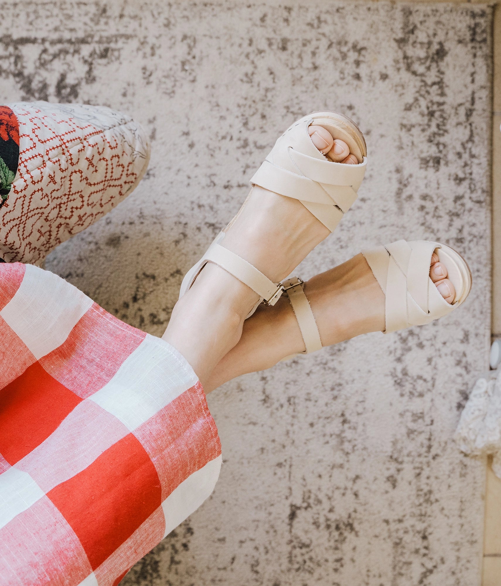 high heeled clog sandals in sand white nubuck leather with an open-toe stapled on a light wooden base