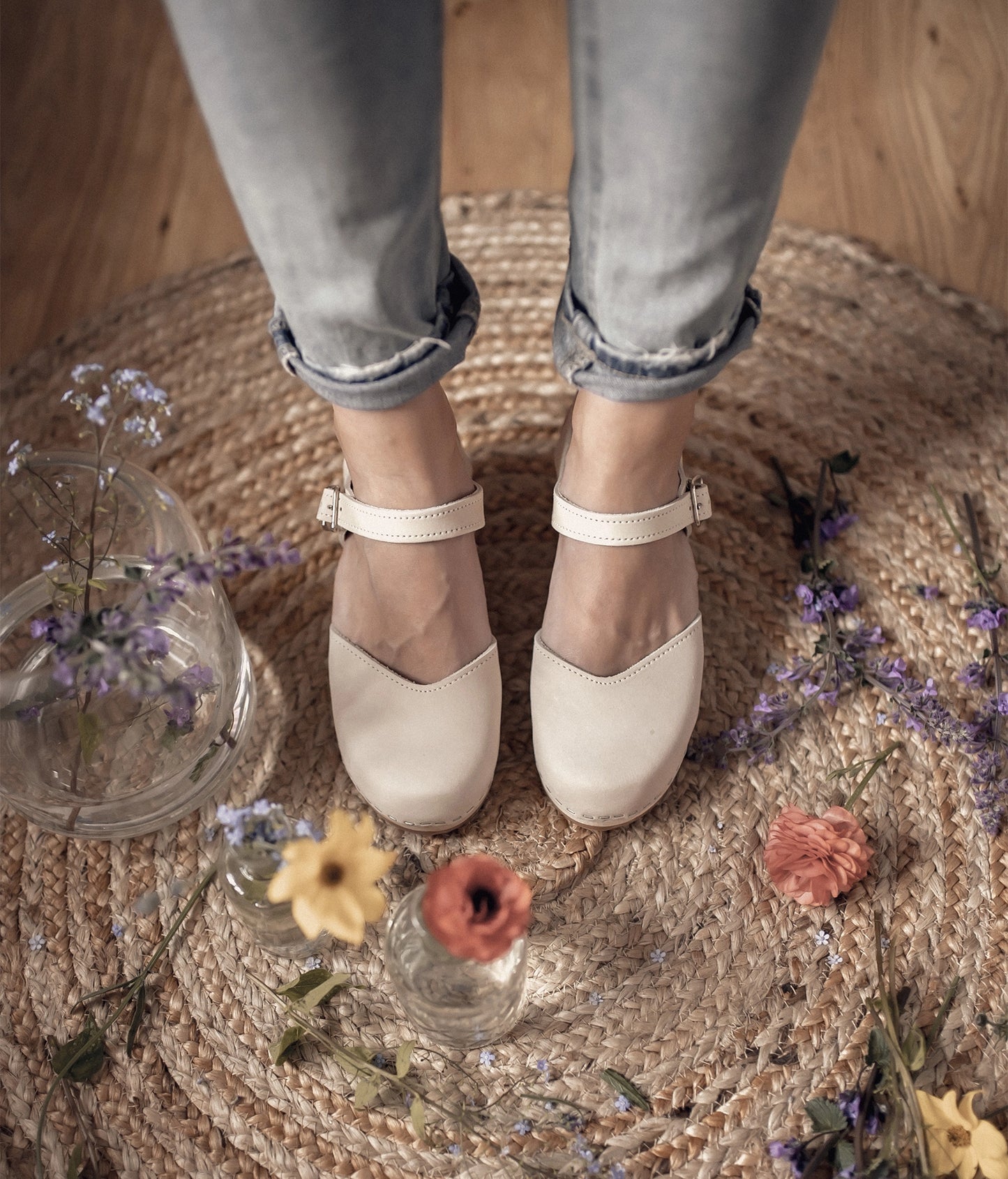 high heeled closed-toe clog sandal in sand white nubuck leather stapled on a light wooden base