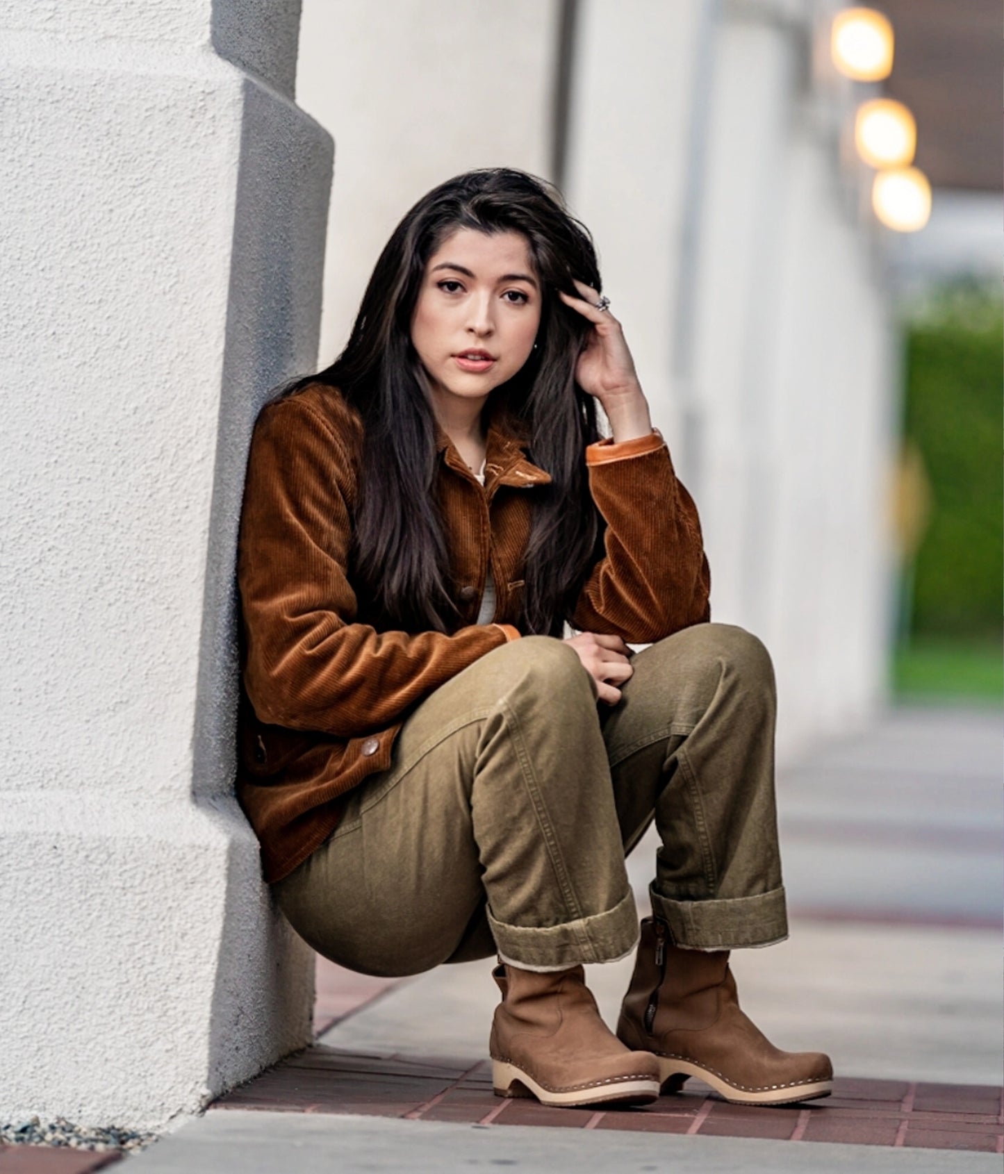 low-heeled clog boots in light brown, dextertan colored nubuck  leather stapled on a light wooden base