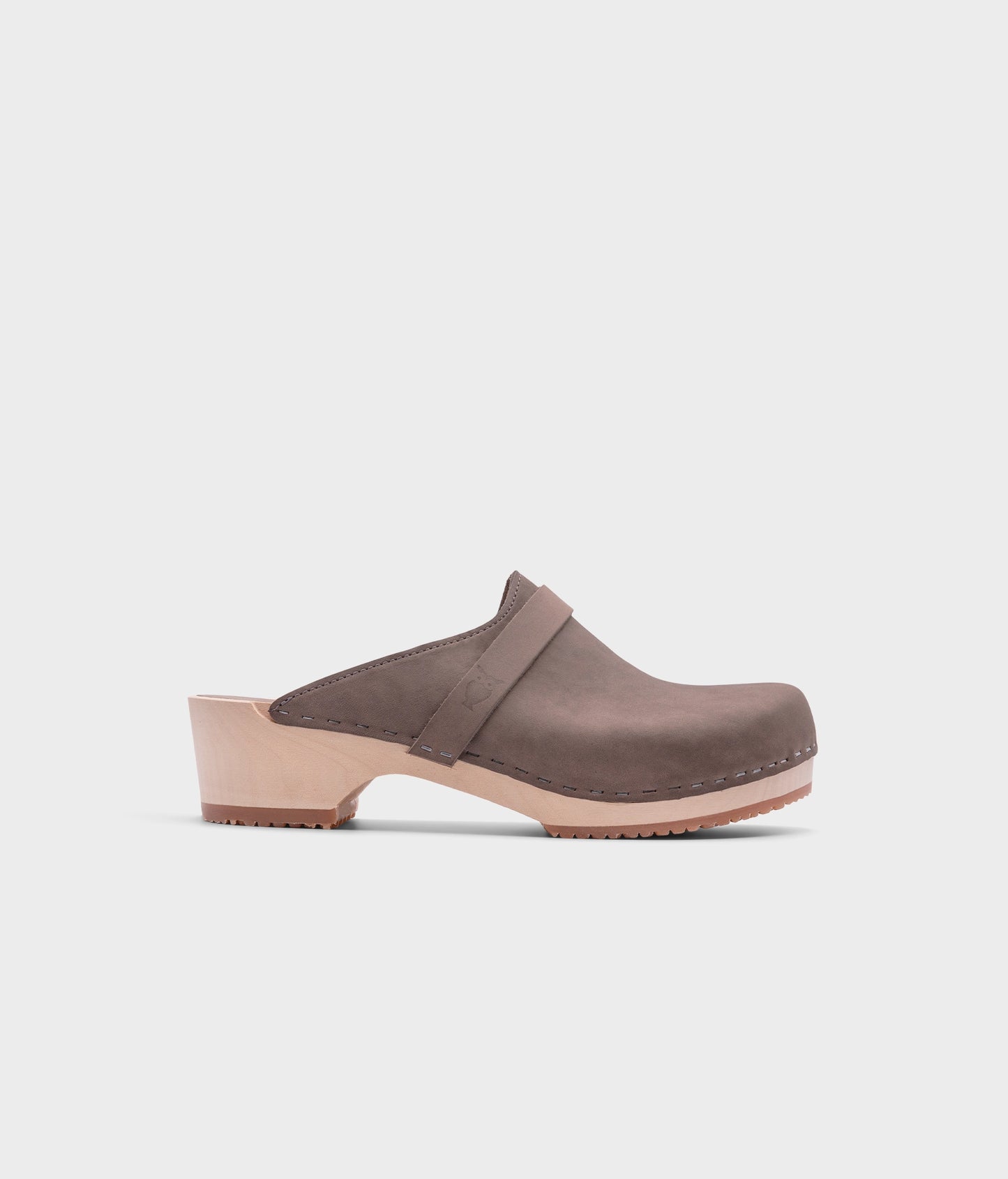 classic low heeled clog mule in stone grey nubuck leather stapled on a light wooden base with a leather strap