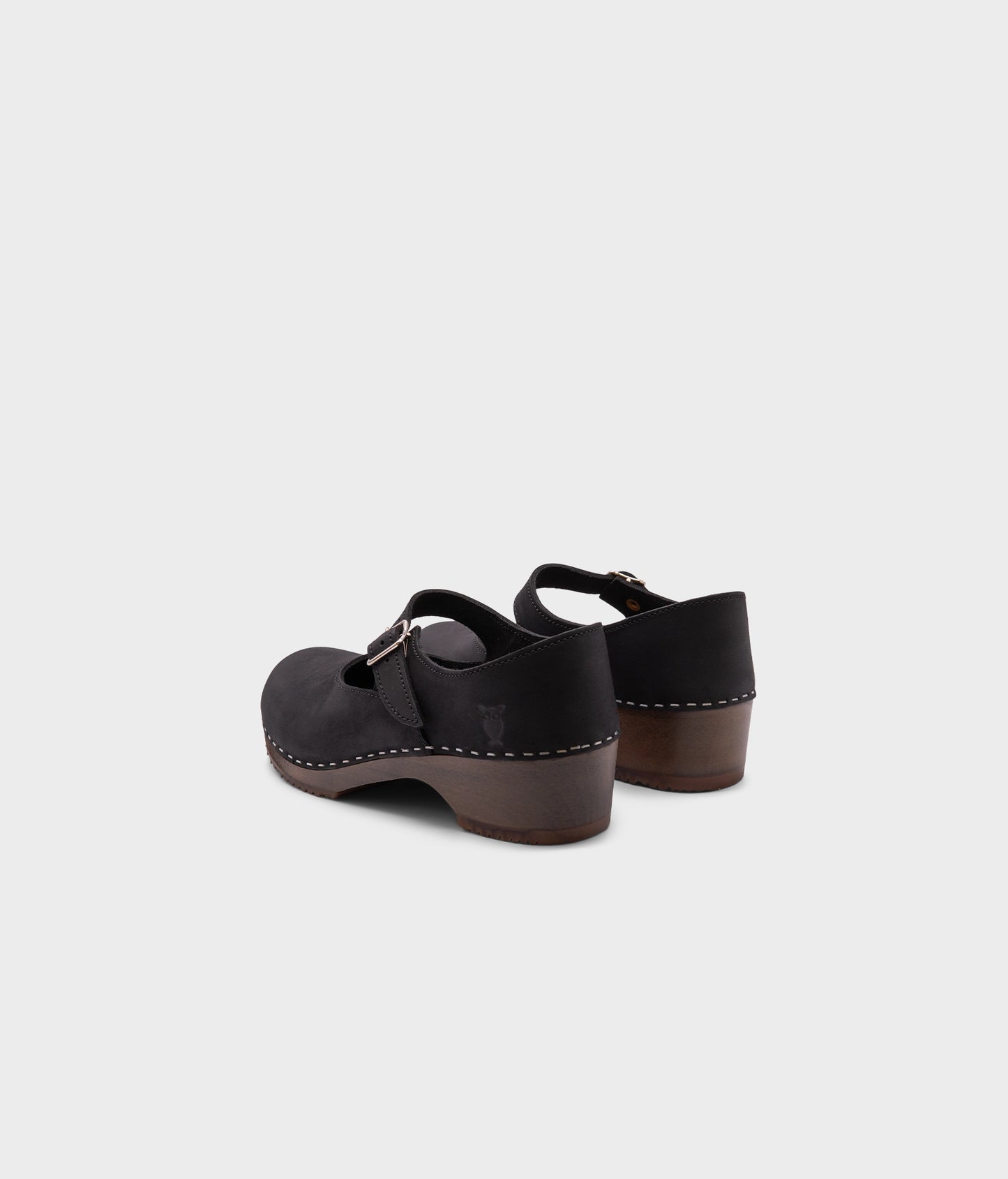 Mary Jane wooden clogs in black nubuck leather stapled on a dark wooden base