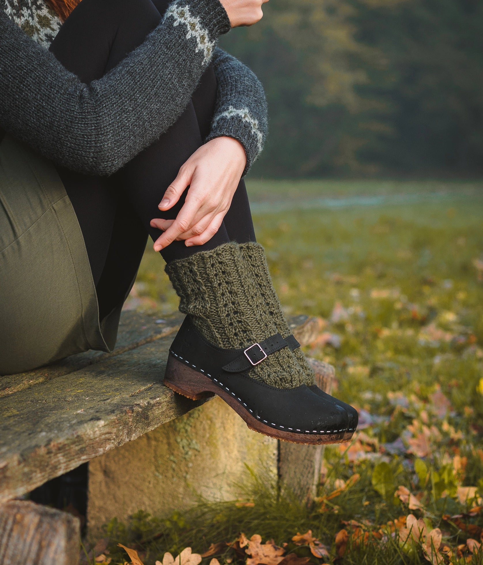 Mary Jane wooden clogs in black nubuck leather stapled on a dark wooden base