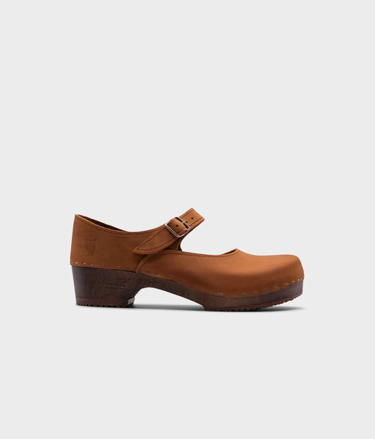Mary Jane wooden clogs in light brown nubuck leather stapled on a dark wooden base