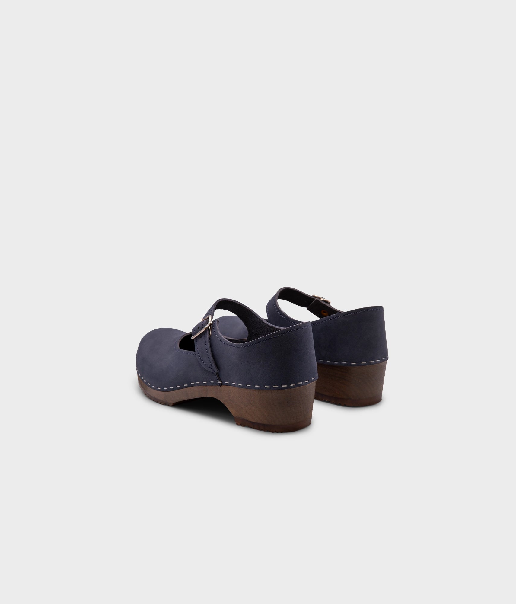 Mary Jane wooden clogs in navy blue nubuck leather stapled on a dark wooden base