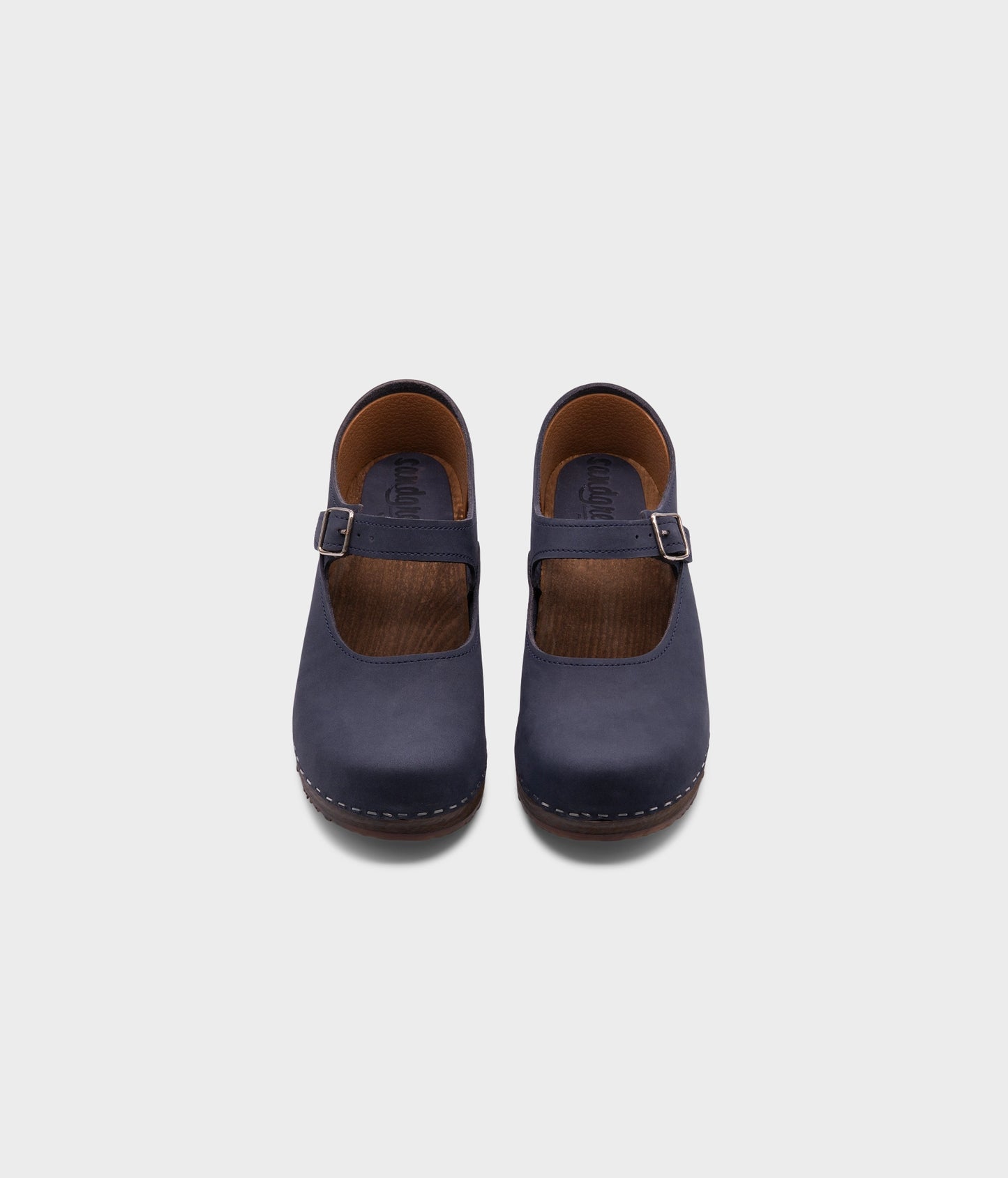 Mary Jane wooden clogs in navy blue nubuck leather stapled on a dark wooden base